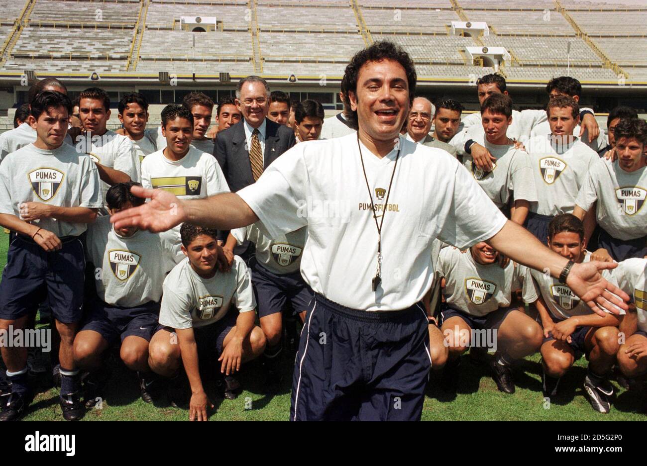 Former Mexican soccer star Hugo Sanchez gestures as he moves back  photographers in the field during his presentation as the new coach of the  soccer team Pumas, which belongs to the National