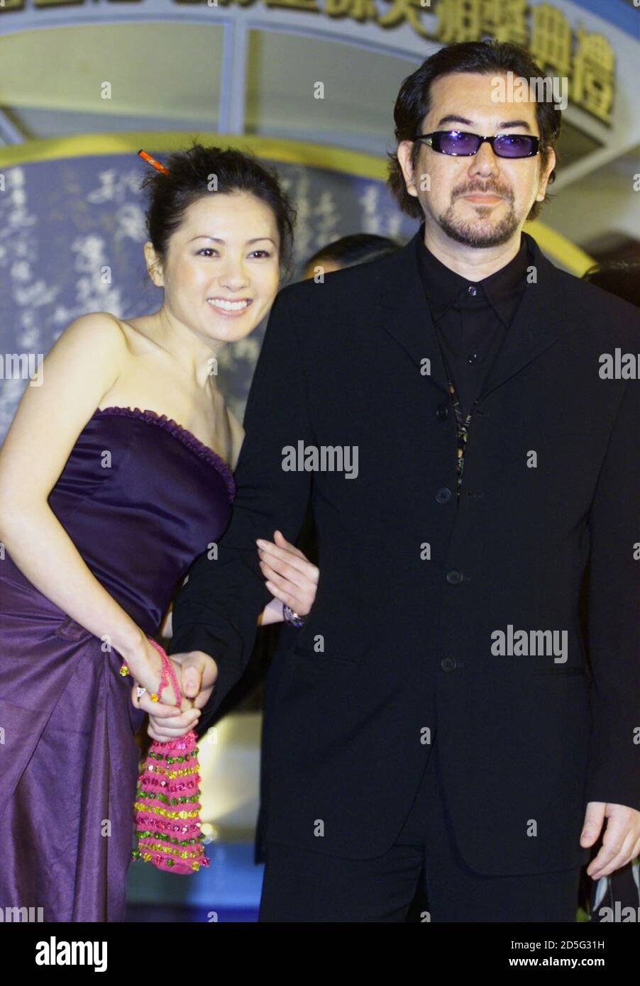 Hong Kong actor Anthony Wong and actress Loletta Lee pose as they arrive at  the 19th Hong Kong Film Awards presentation ceremony April 16. Wong, a  two-time Best Actor winner, is nominated