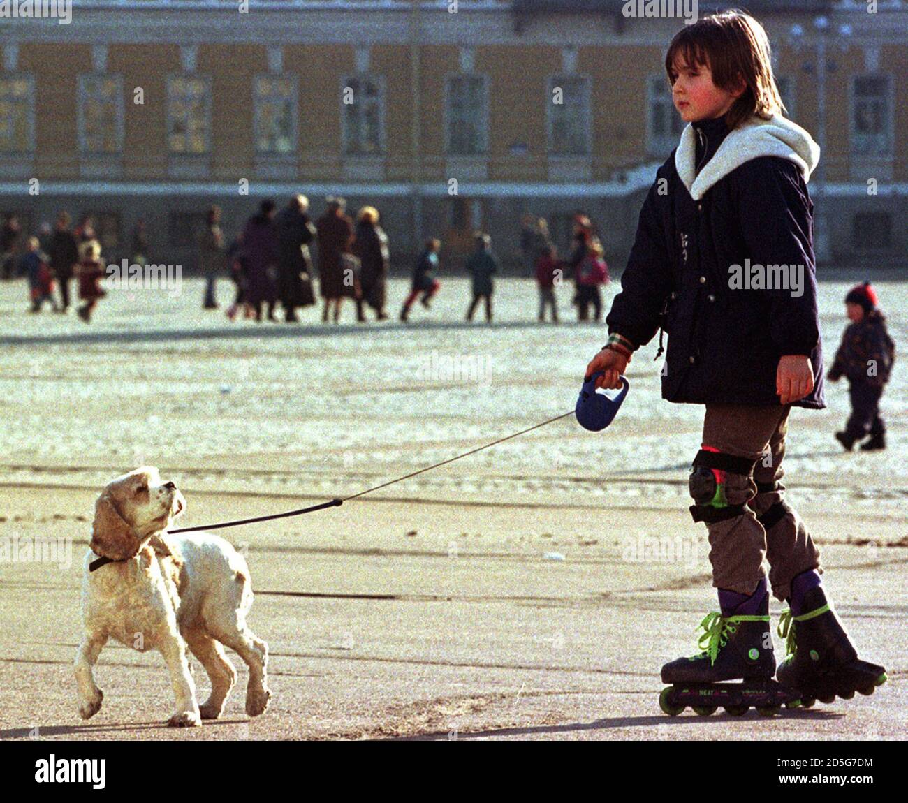 A girl roller-blades with her dog in the sunshine on a central square of  St. Petersburg March 21. This weekend is the start of the school spring  holiday in Russia. GD/CLH Stock