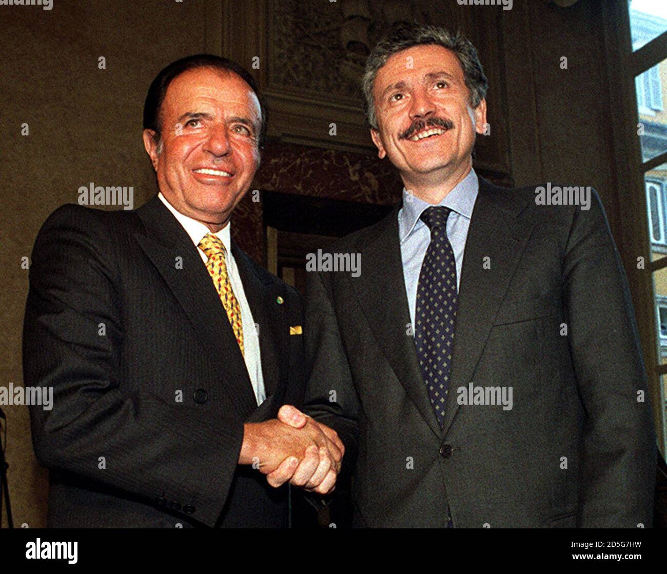 Argentine President Carlos Menem L Shakes Hands With Italian Prime Minister Massimo D Alema During Their