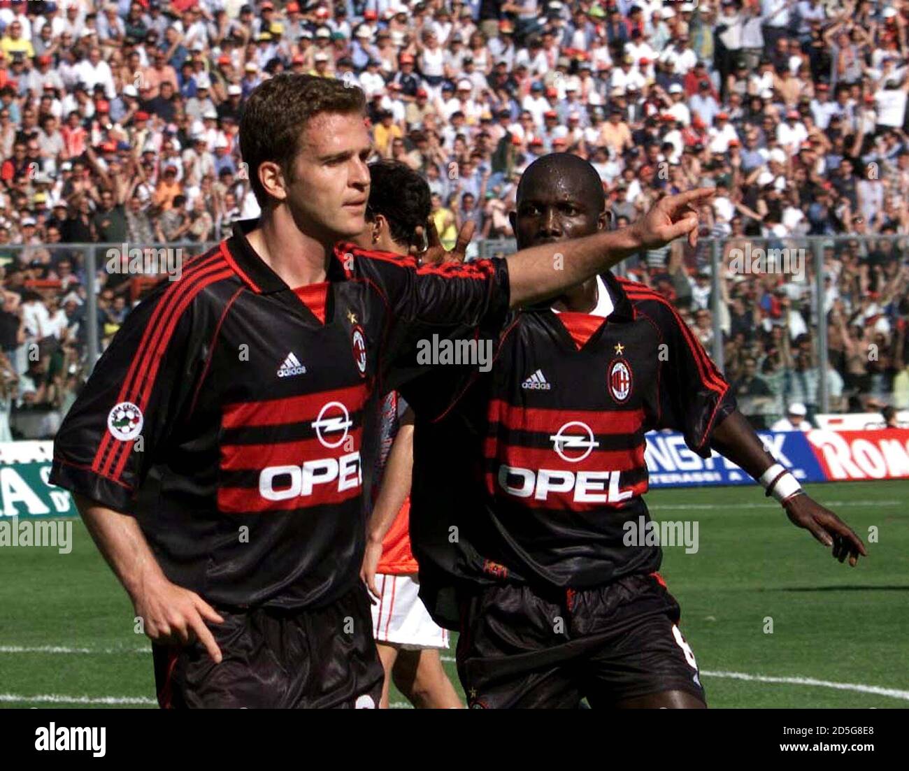 AC Milan's German striker Oliver Bierhoff (L) celebrates after scoring  against Perugia with Liberian teammate George Weah during their Serie A  soccer match in Perugia May 23. AC Milan face Perugia on