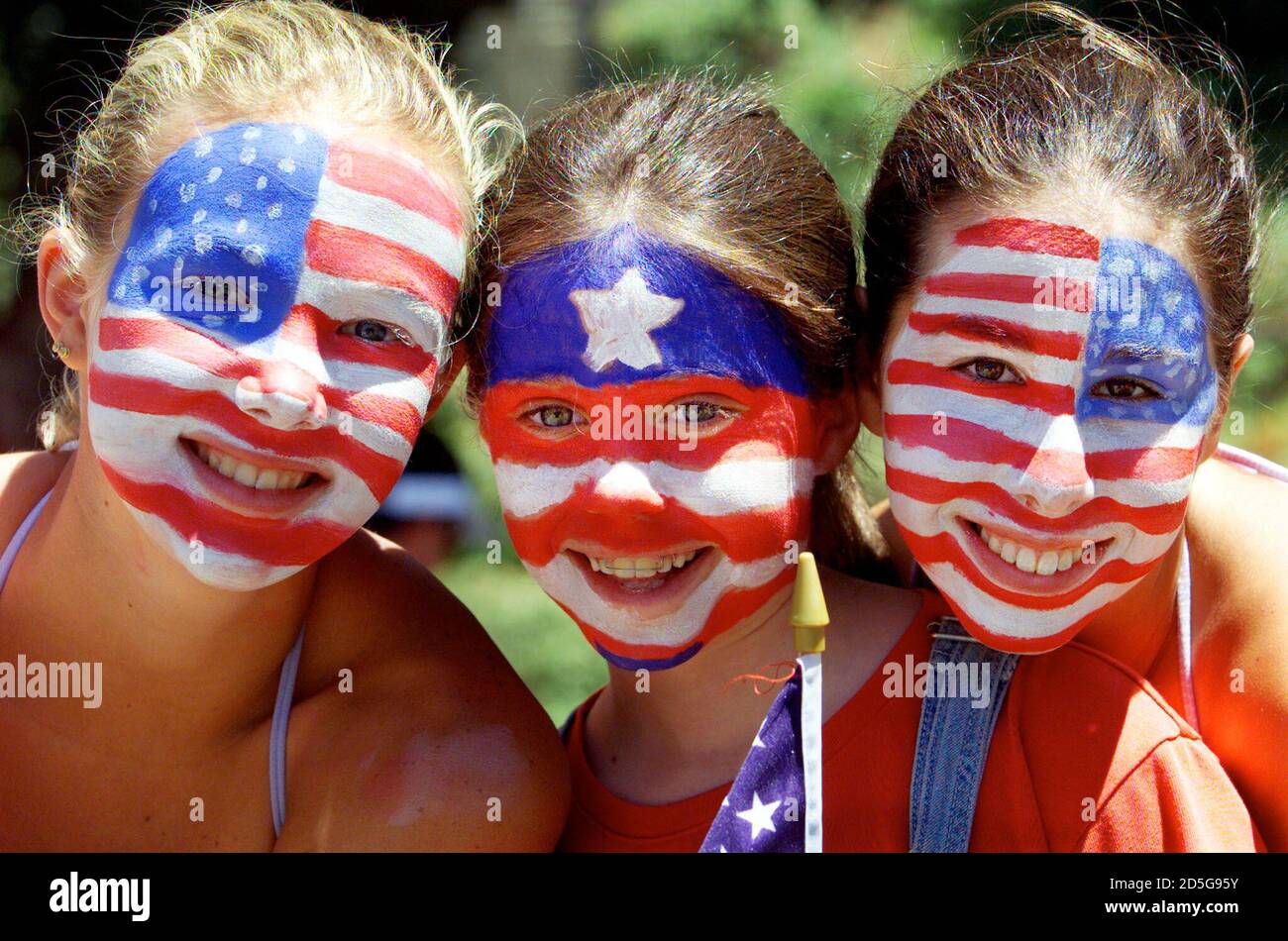 Soccer fans Emily Brown (L), Madelaine Jannsauberger(C) and Allison  Rosewatt show off their painted faces as they wait in line to enter  Stanford Stadium for the USA-Brazil semi-final match at the Women's