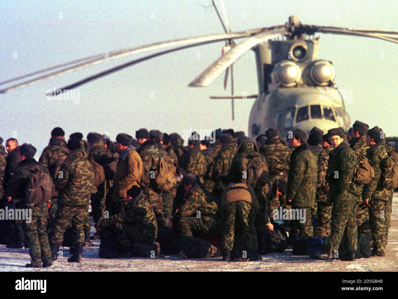 Russian soldiers wait to be transported to their positions after arriving  at Mozdok military airbase November