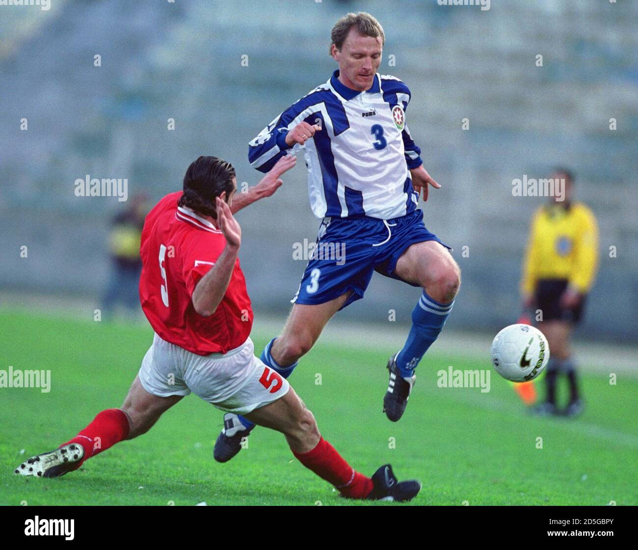 Azerbaijan's Igor Getman (R) evades a tackle from Malta's Darren Debono  during the match between the two sides at Ta Qali on February 6. In this  second match of the Rothmans Football