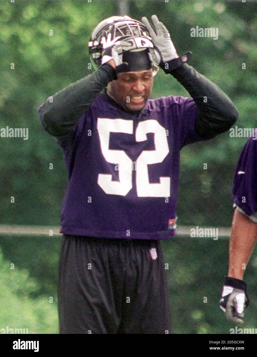 Baltimore Ravens' linebacker Ray Lewis takes his helmet off during a brief  break in the first day of mini-camp at the teams' training facility, June  12. It was the first time for