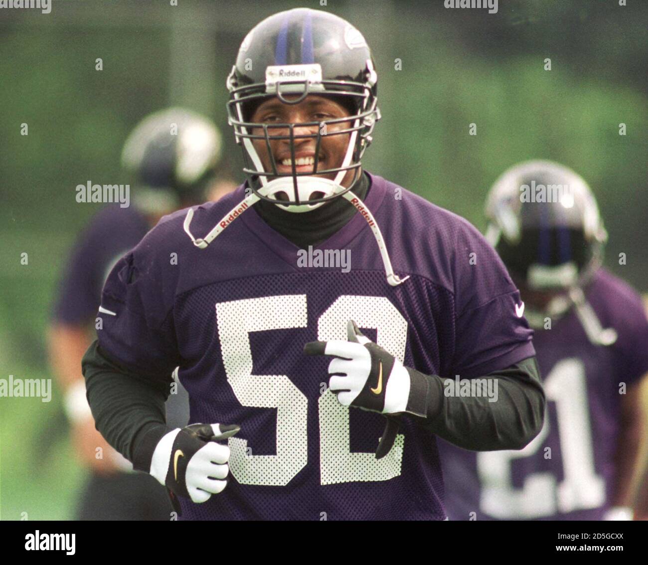 Baltimore Ravens' linebacker Ray Lewis smiles as he jogs on the field  during the first day of mini-camp at the teams' training facility, June 12.  It marked the first time Lewis was