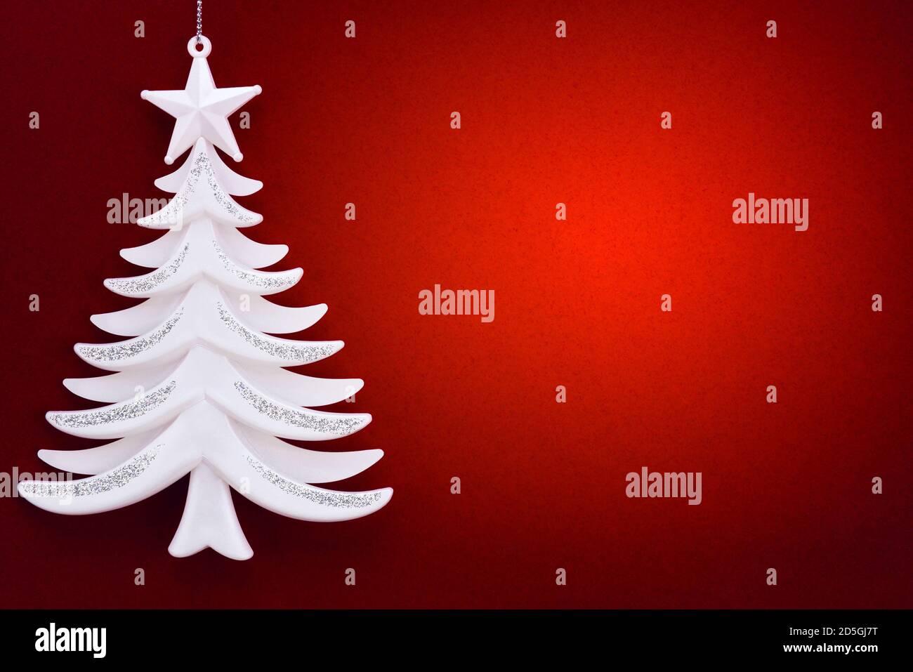 Christmas tree on a background of red velvet paper Stock Photo - Alamy