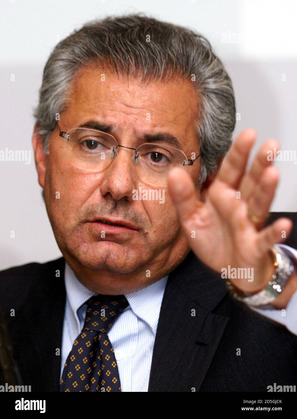 New Telecom Italia boss Roberto Colaninno gestures during a news conference  in Rome September 2. Colaninno said the 13,000 job losses the company  planned in coming years included those going into retirement.