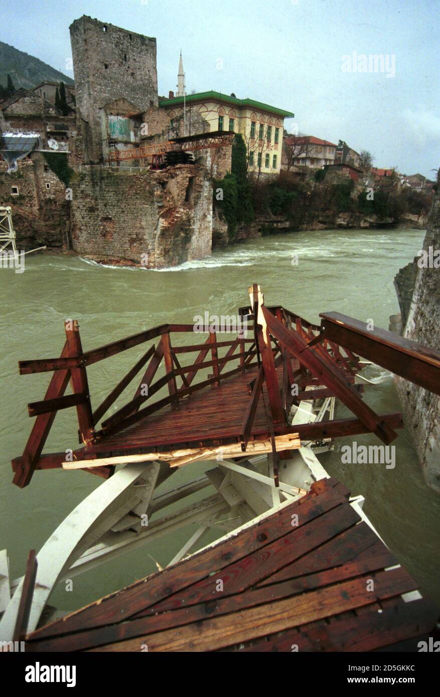 An impromised bridge over the Neretva River lies destroyed in the strongly flowing flooded river in Mostar December 17. The bridge was built to replace the old historical bridge destroyed during the Croat-Moslem war along with 45 flats and 10 private houses in the centre of Mostar of this historic city.  MB/WS Stock Photo