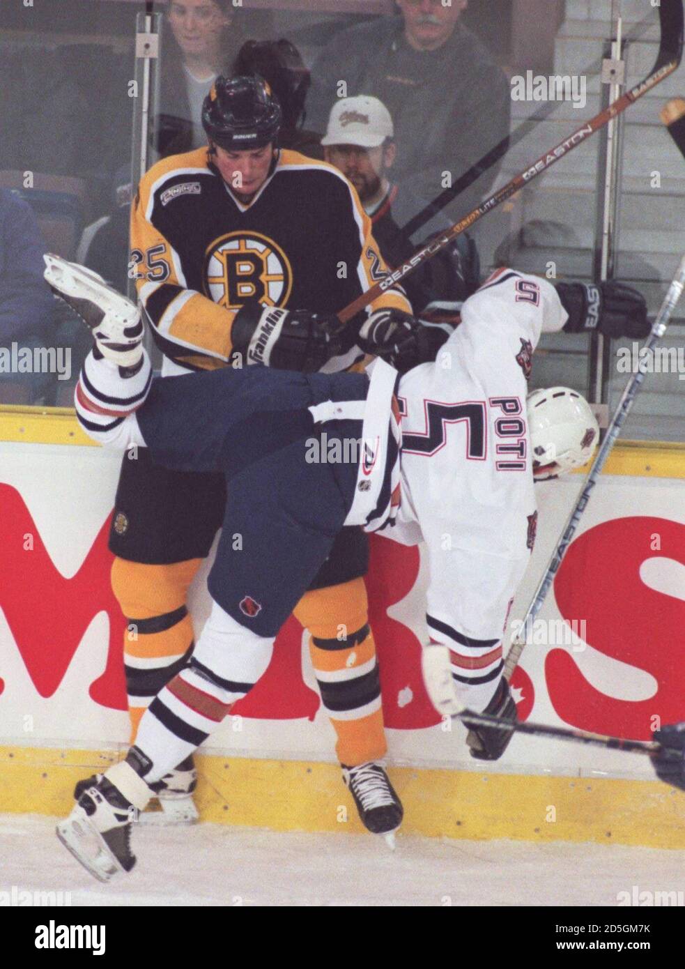 hoogtepunt antwoord Fabel Edmonton Oiler Tom Poti (5) gets upended by Boston Bruins defenseman Hal  Gill (25) during first period action February 23 at the Skyreach Center in  Edmonton. GAC Stock Photo - Alamy