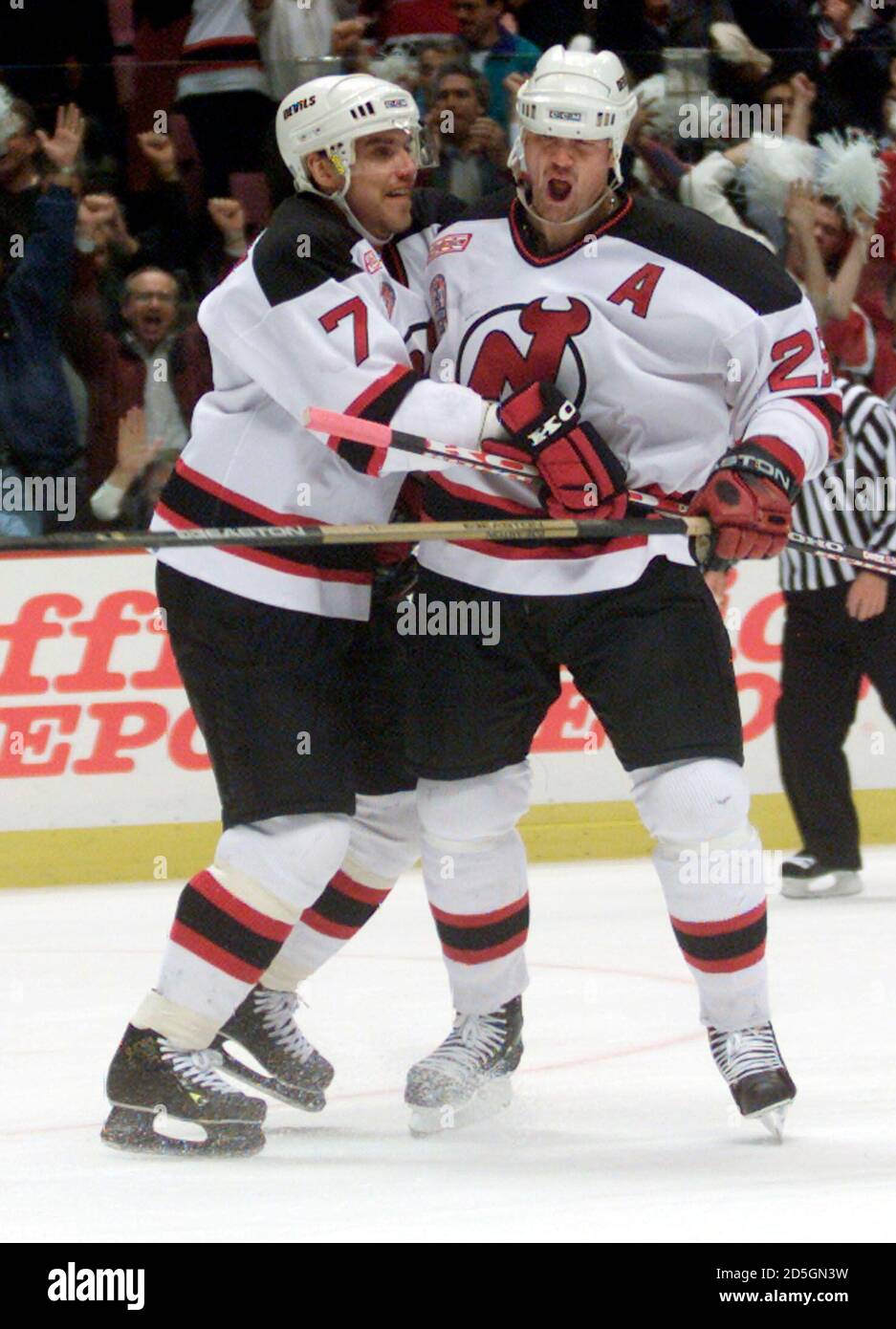 New Jersey Devils' center Jason Arnott (R) celebrates his first period goal  against the Dallas Stars with his teammate Vladimir Bombardir in Game 1 of  the 2000 Stanley Cup, at Meadowlands Arena