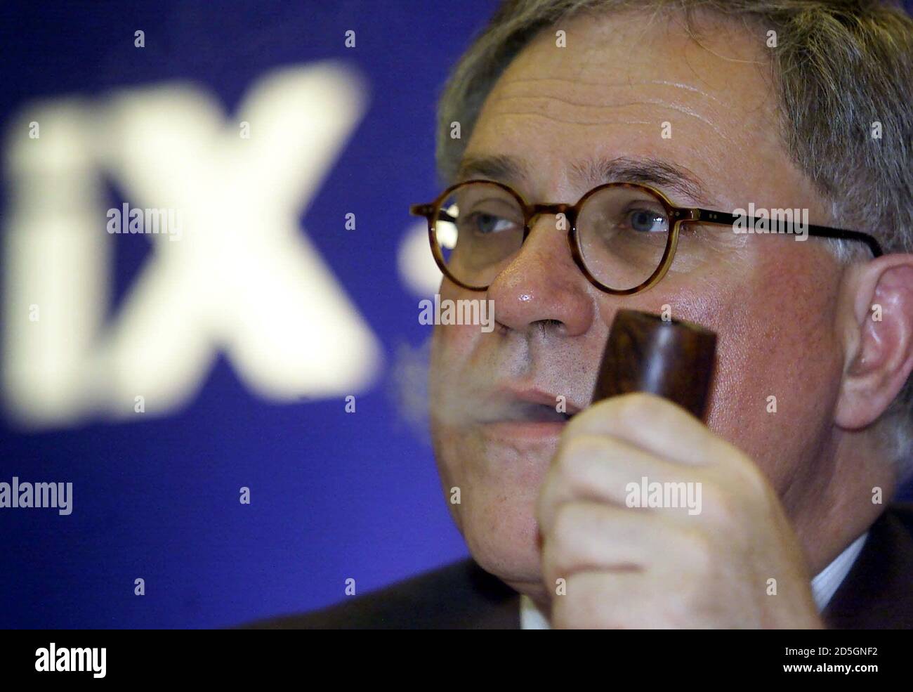 Werner Seifert, chairman of Deutsche Boerse AG and designated CEO of "iX  international exchange", smokes a pipe when he listens to reporter's  questions during a news conference in Frankfurt, July 17. Deutsche
