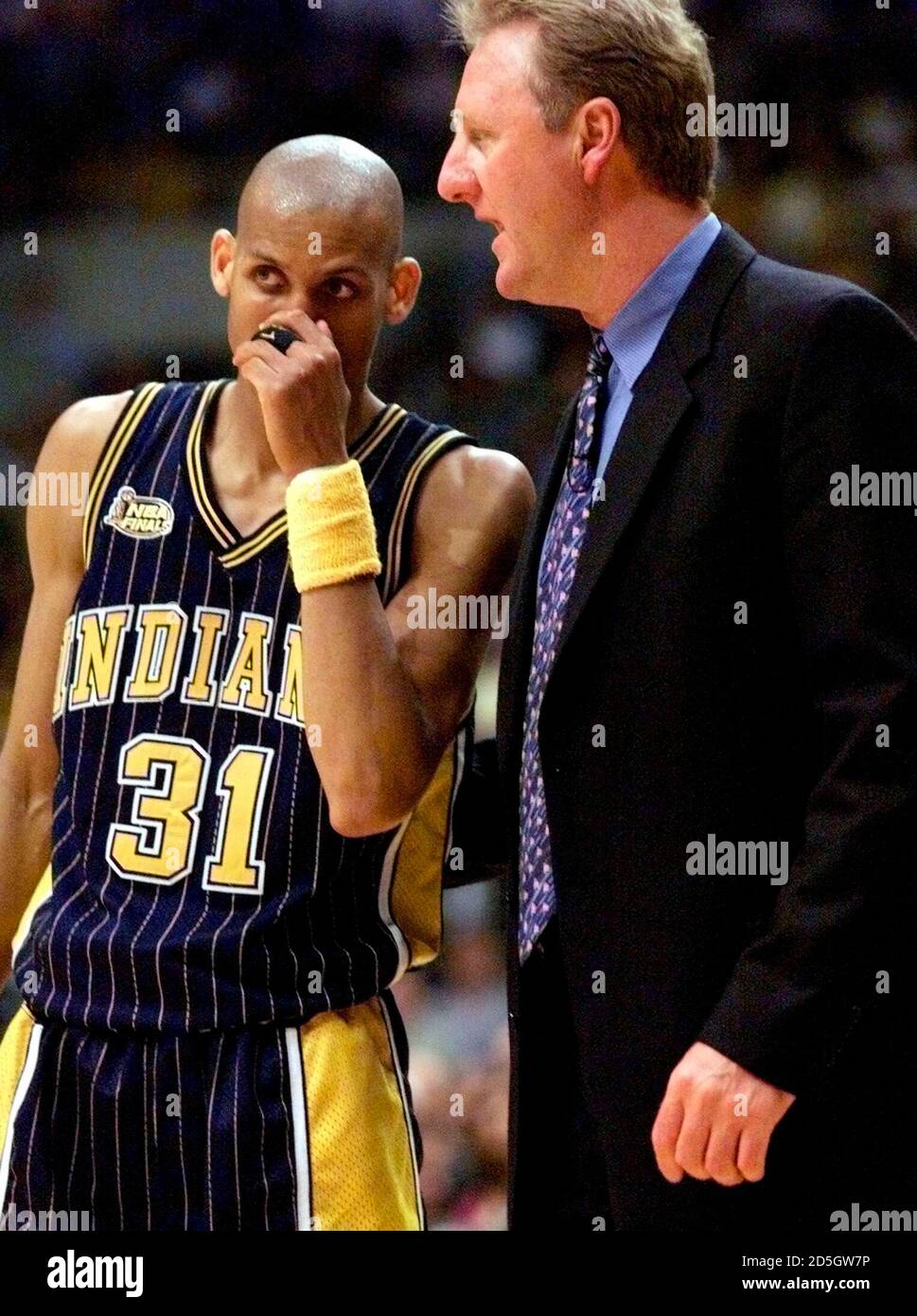 Indiana Pacers' coach Larry Bird talks with Reggie Miller during the final  minute of game 2 of the NBA Finals, in Los Angeles June 9. The Lakers took  a 2-0 lead in