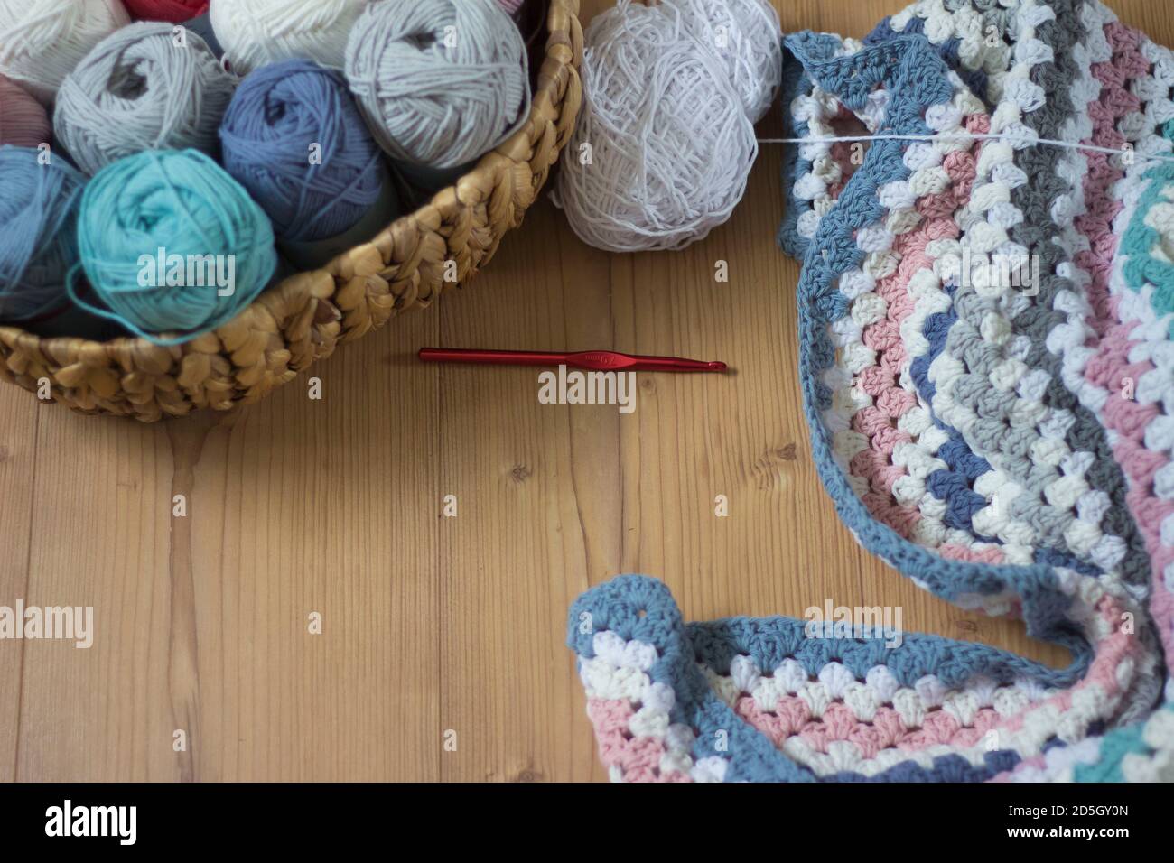 handmade blanket with wool and crochet hook Stock Photo