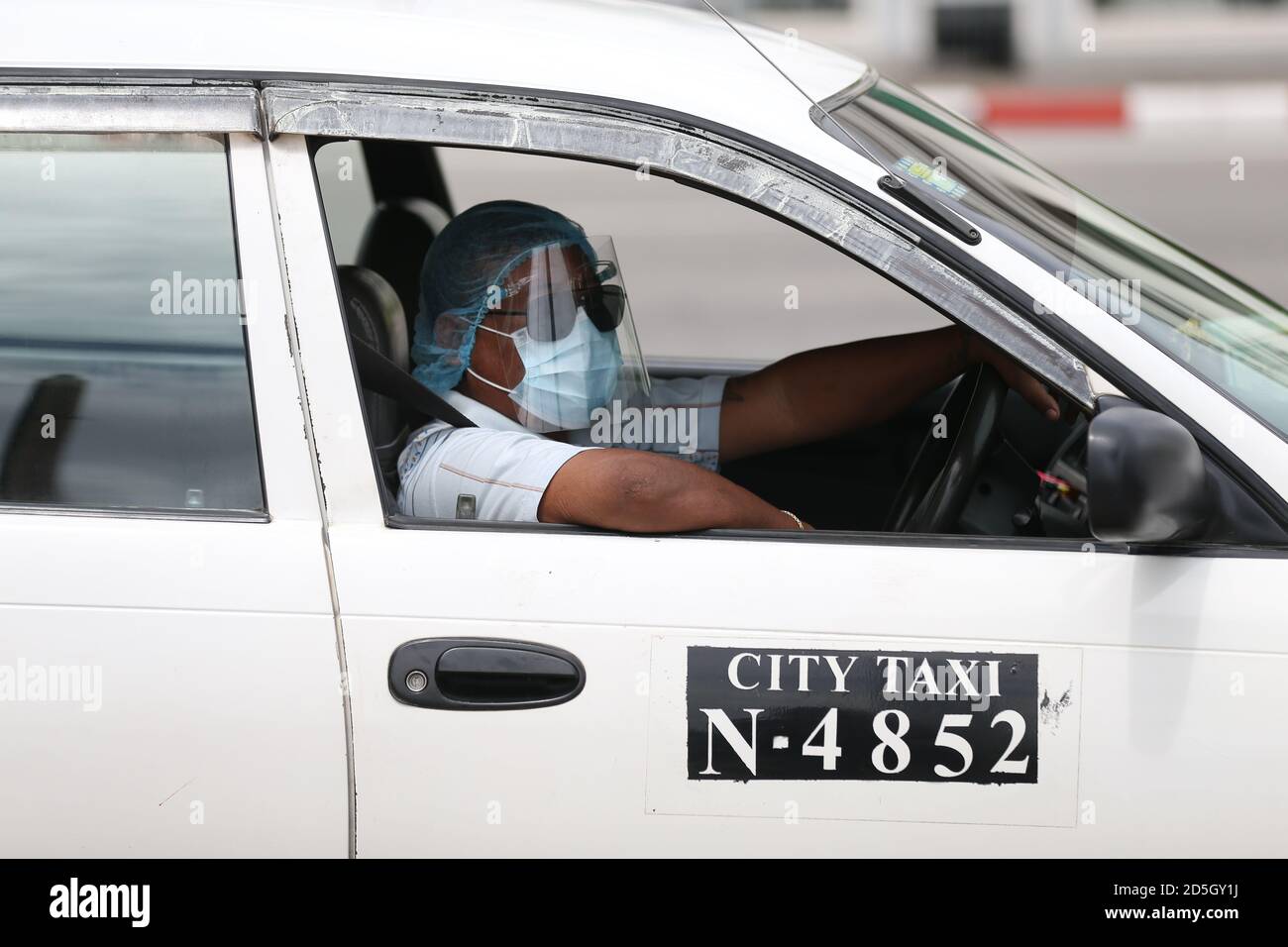 Yangon Myanmar 13th Oct 2020 A Taxi Driver Wearing A Mask And Face Shield Waits For Passengers In Yangon Myanmar Oct 13 2020 The Total Number Of Covid 19 Cases In Myanmar Has