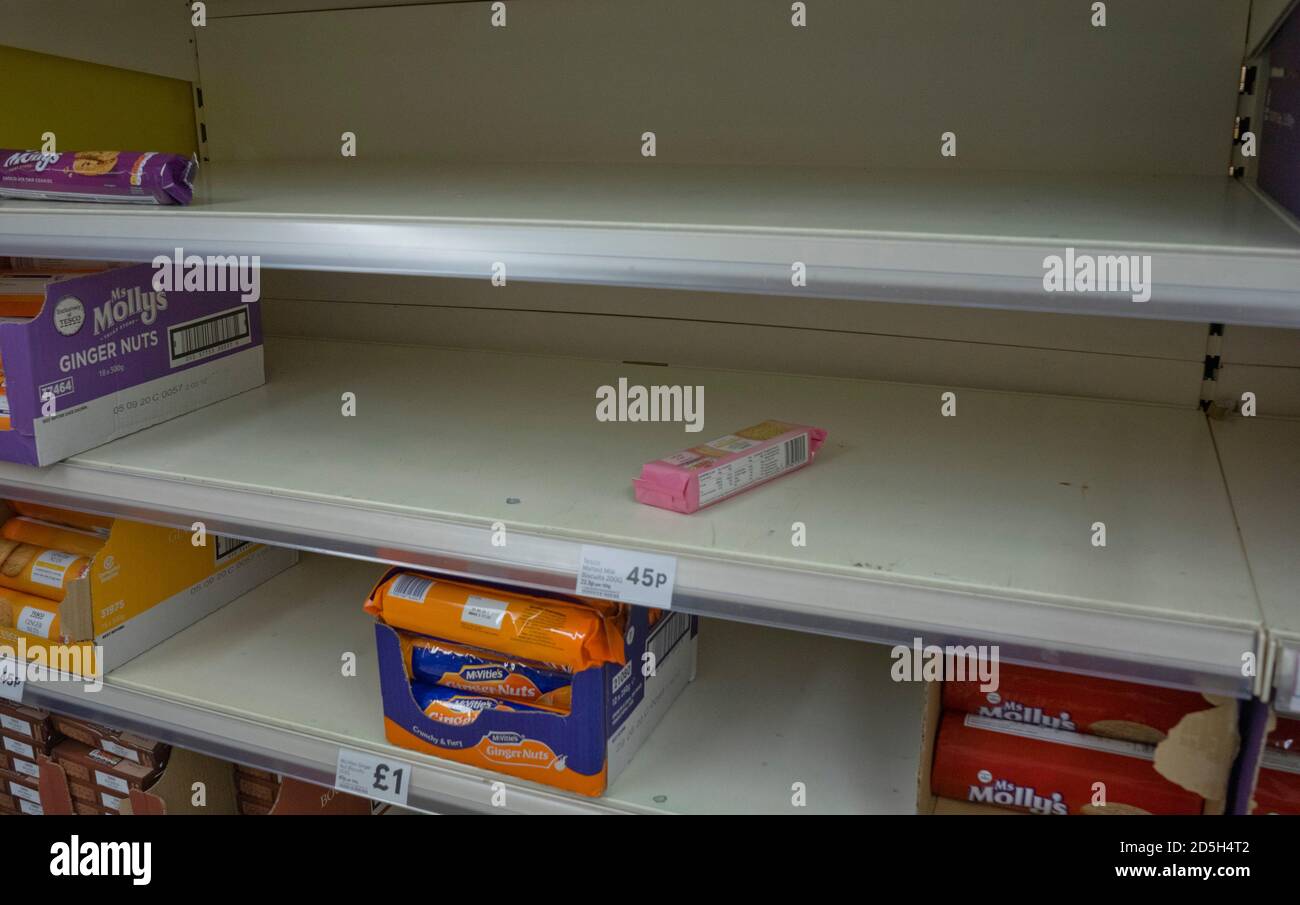 Empty shelves as customers load basic goods due to Coronavirus epidemic