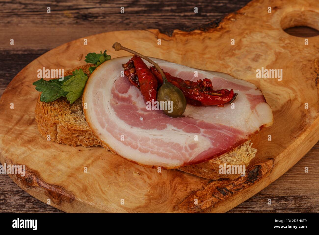 Italian snack Bruschetta with pancetta sausages Stock Photo Alamy