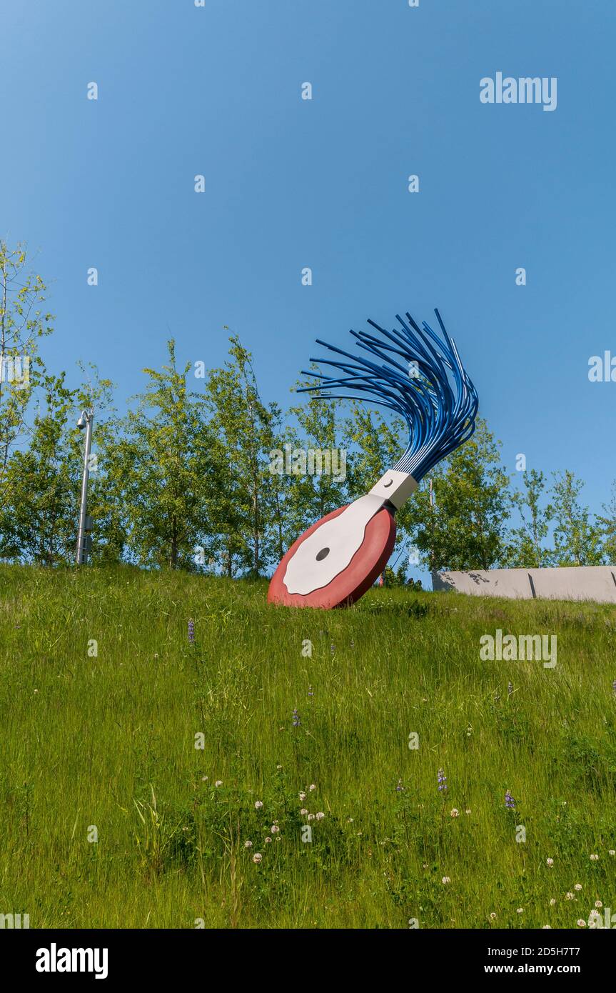 Large sculpture of wheel typewriter eraser with brush in Olympic