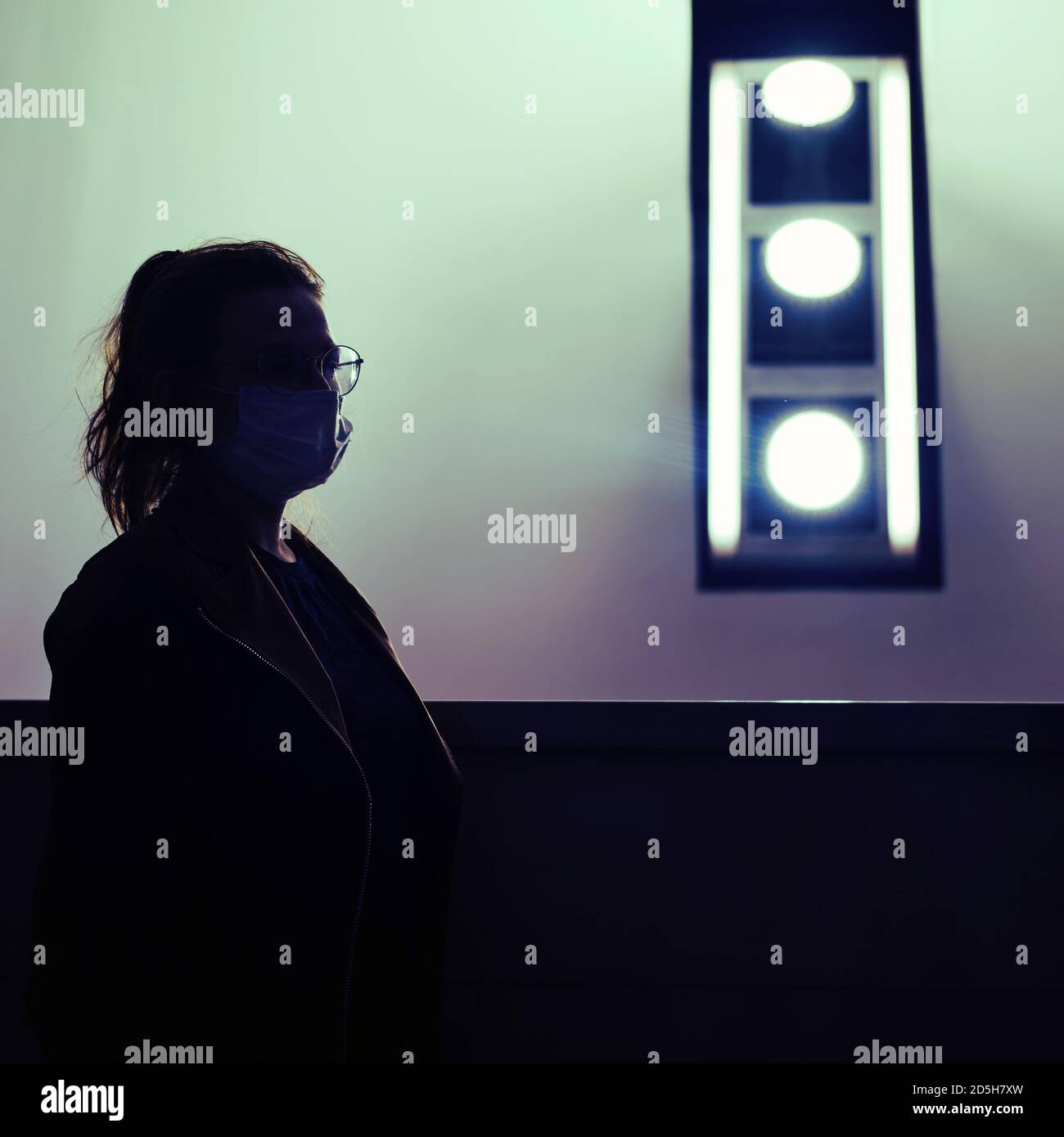 Silhouette of a female doctor in a medical mask Stock Photo