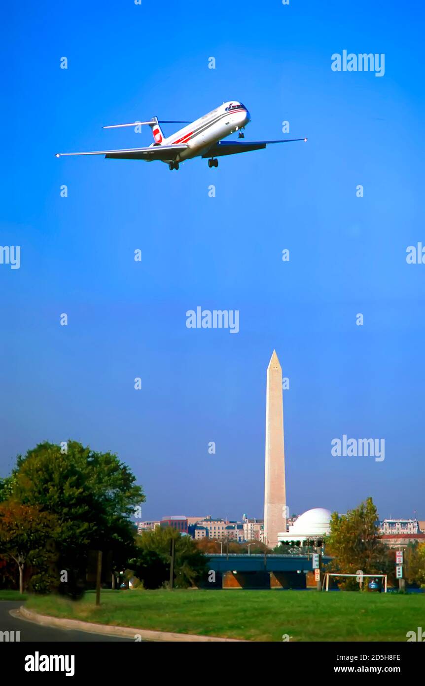 Jet Air Plane lands at Reagan National airport, in view of the Washington Memorial - Washing D.C. Stock Photo