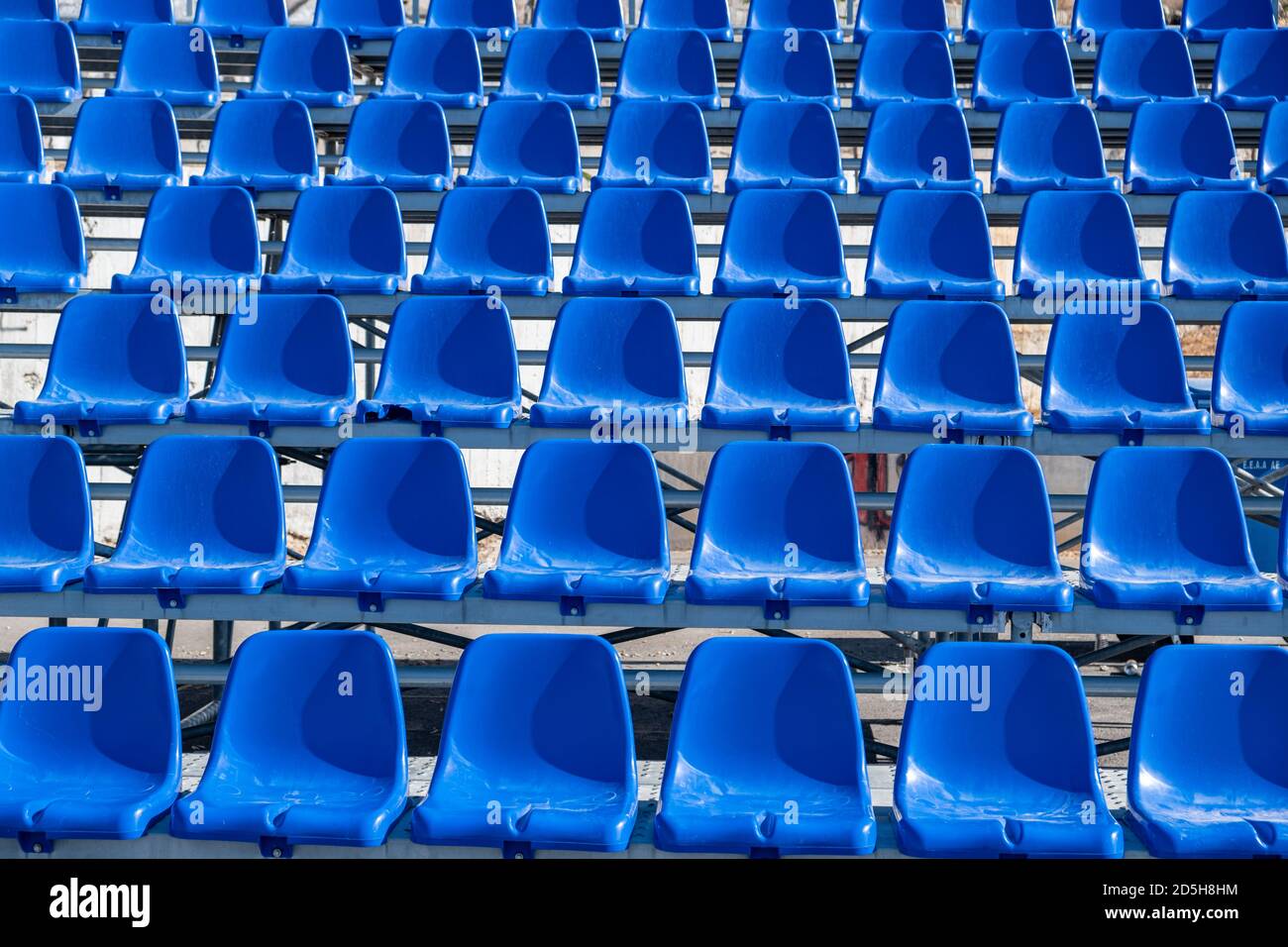 Stadium seats background. Rows of blue plastic empty seats. Sports