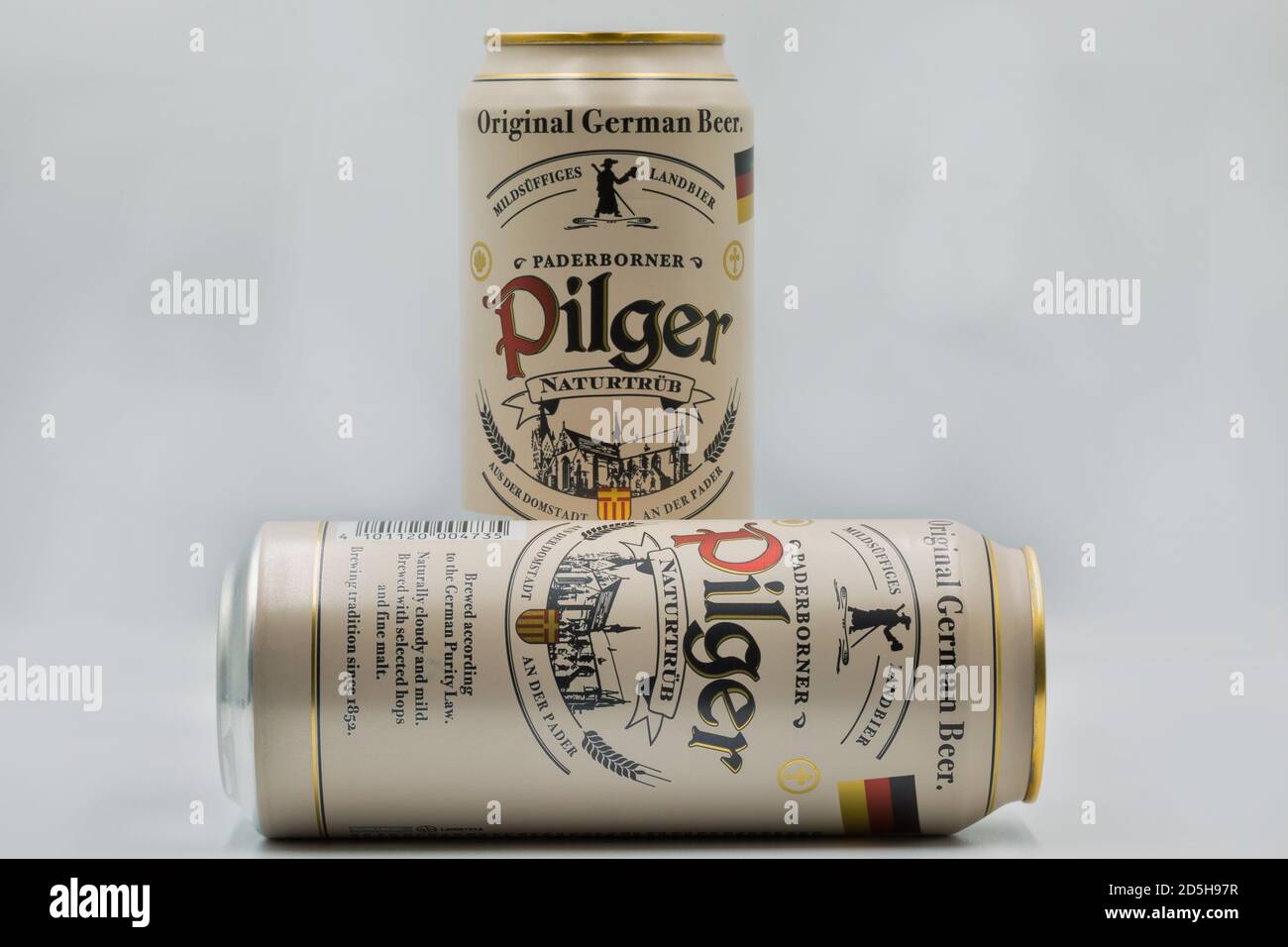 KYIV, UKRAINE - AUGUST 22, 2020: Raderborner Pilger original German beer cans closeup against white background. Stock Photo
