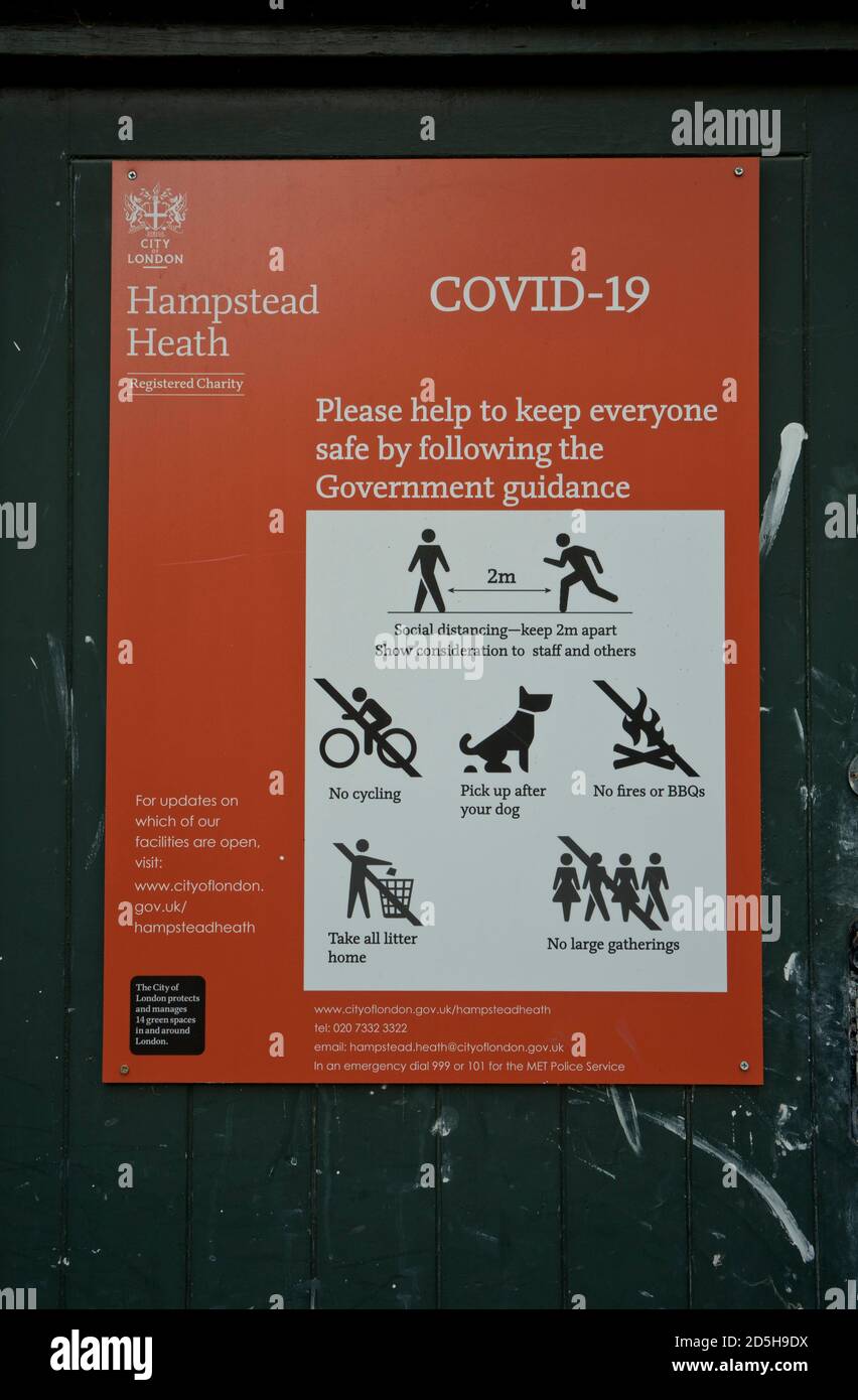 Sign in Hampstead Heath park advising to keep safe social distance due