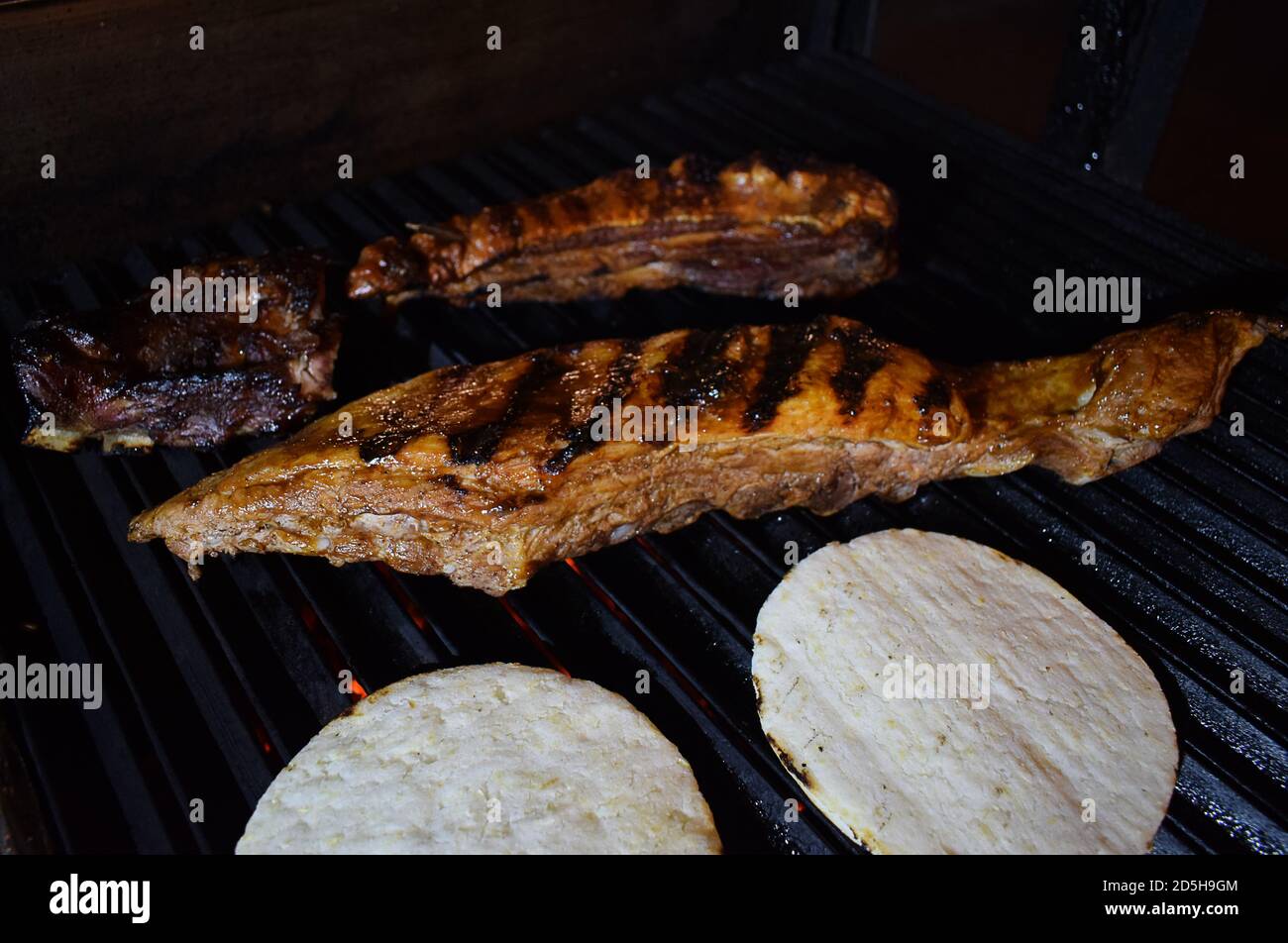 pork baby back ribs on a grill Stock Photo Alamy