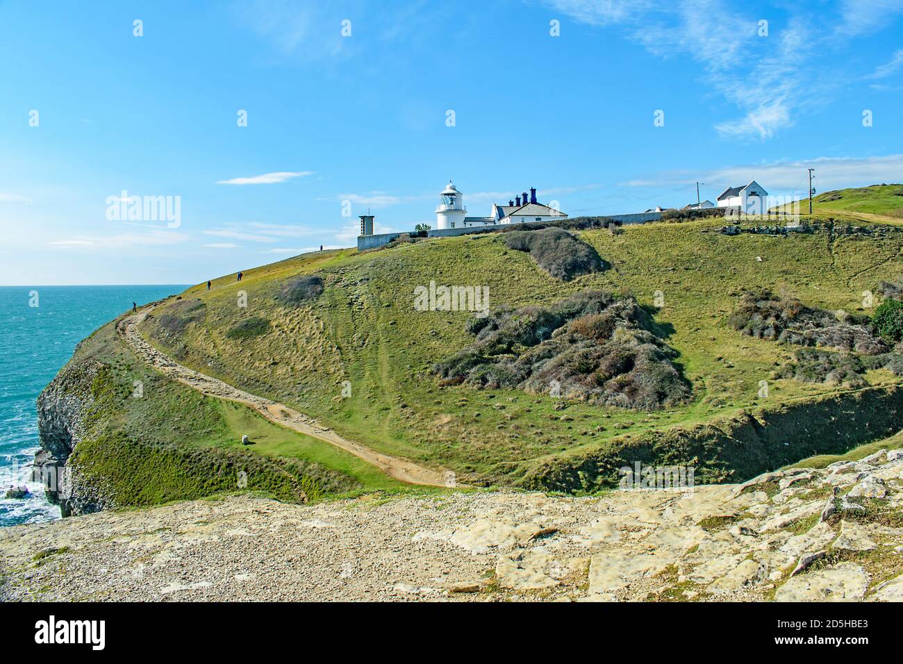 A view of the curving coastal path up to Anvil Point near Swanage Dorset Stock Photo