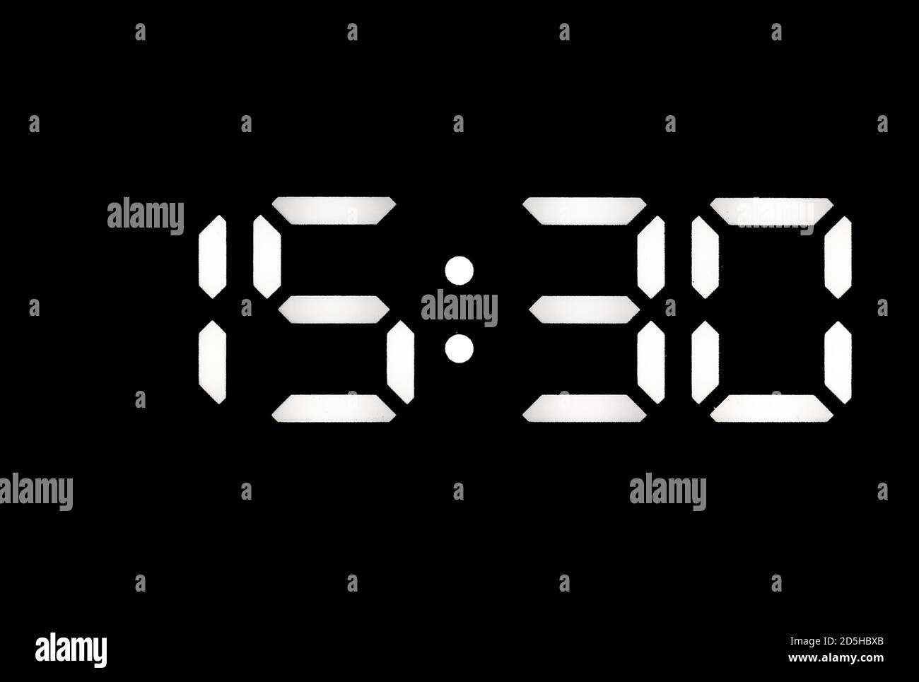 Real white led digital clock on a black background showing time 15:30 Stock  Photo - Alamy