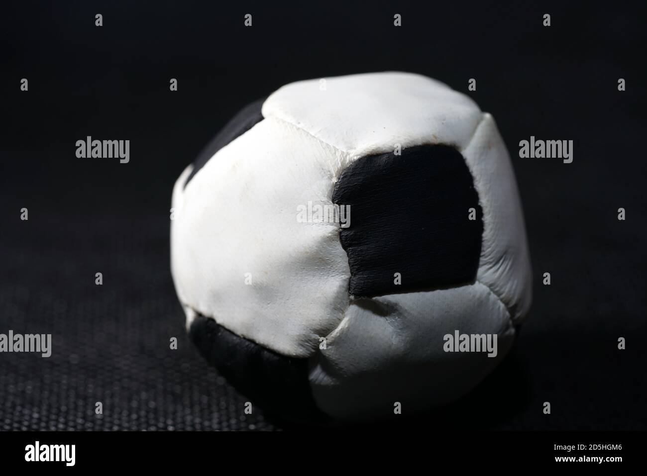 Closeup shot of the small soccer ball on the black background Stock