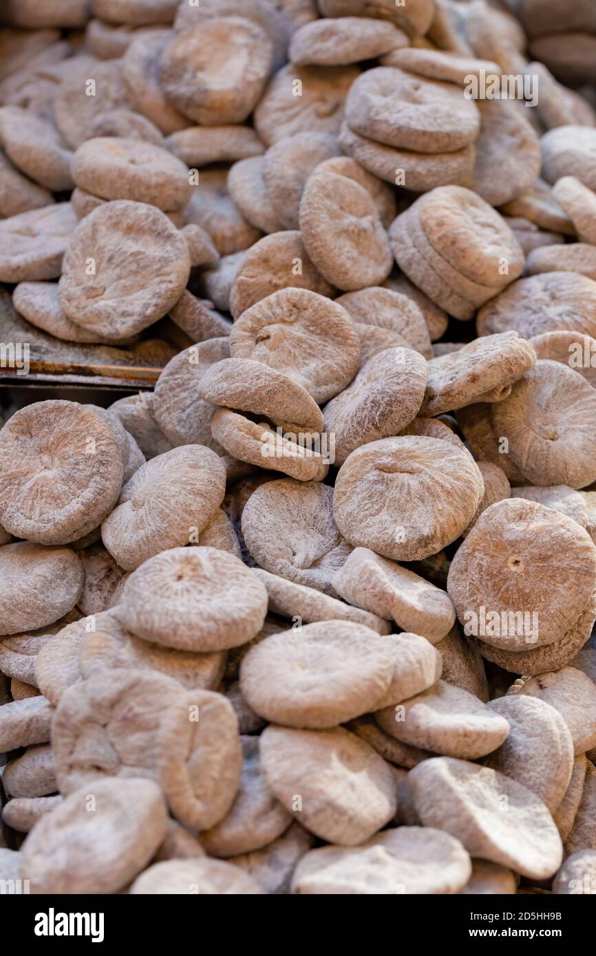 Pile of dried figs, coated in wheat flour, on a UK market stall Stock
