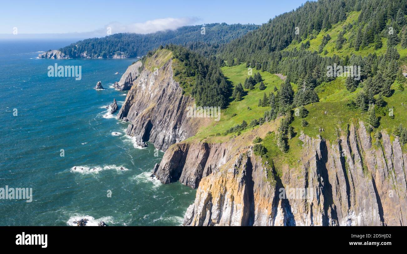 The Pacific Ocean washes against the dramatic coastline of Oregon, not far from Portland. This part of the United States is known for its scenery. Stock Photo