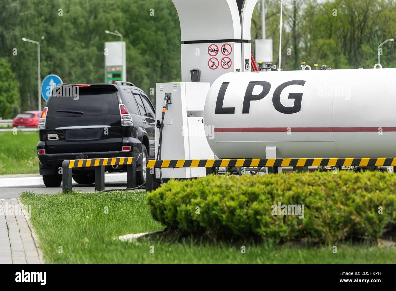 Liquid propane gas station. Black modern SUV car refueling tank with alternative power natural liquefied fuel Stock Photo