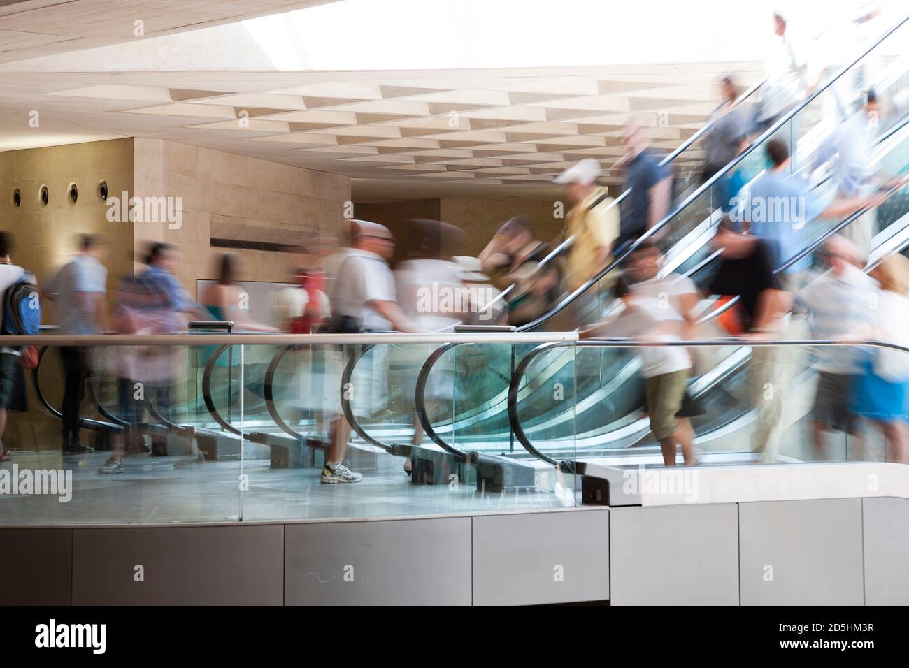 People on escalator, rush hour, motion blur Stock Photo