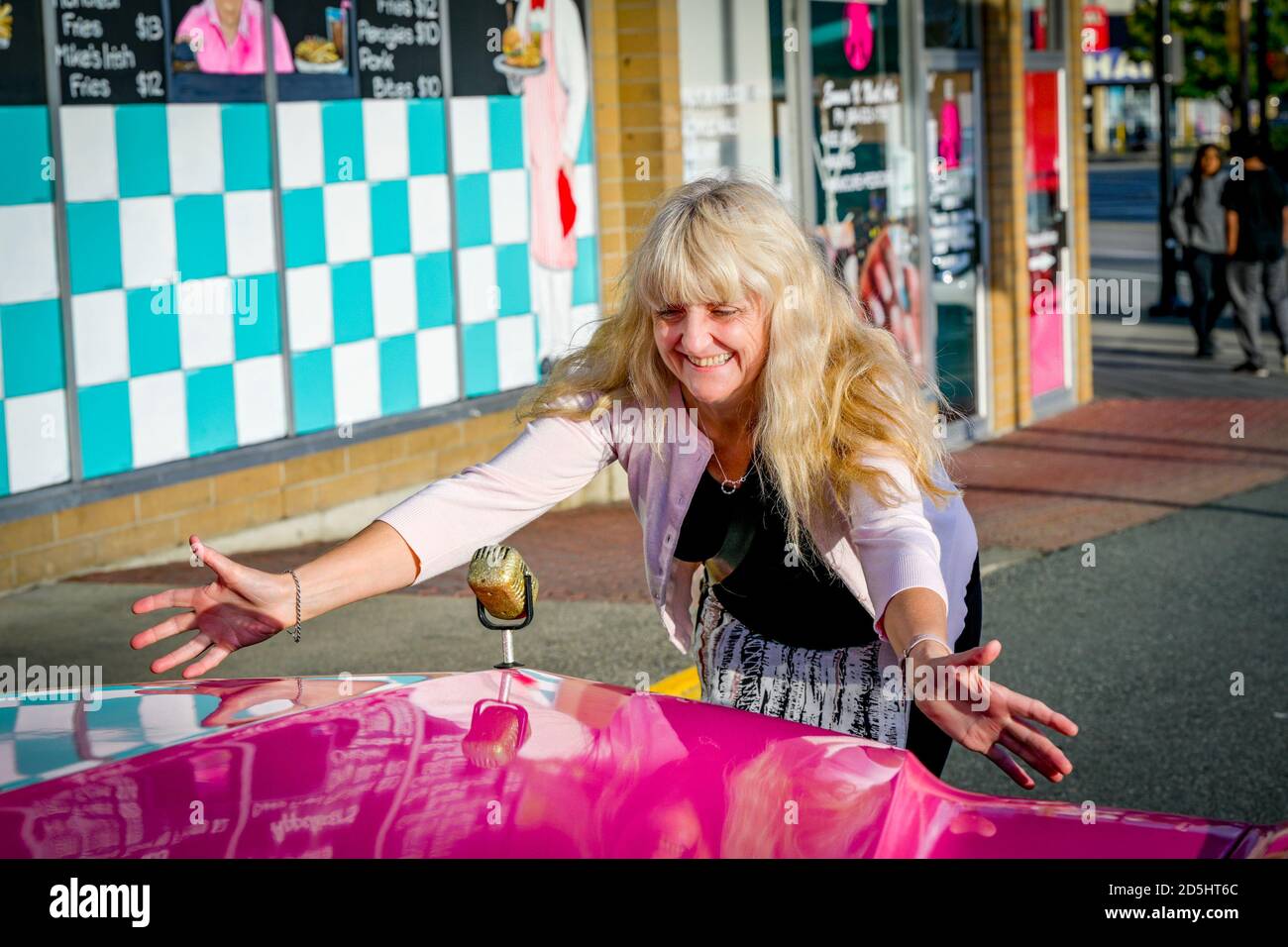 Pink Cadillac car with microphone hood ornament, , Brogans Diner, Langley, British Columbia, Canada Stock Photo