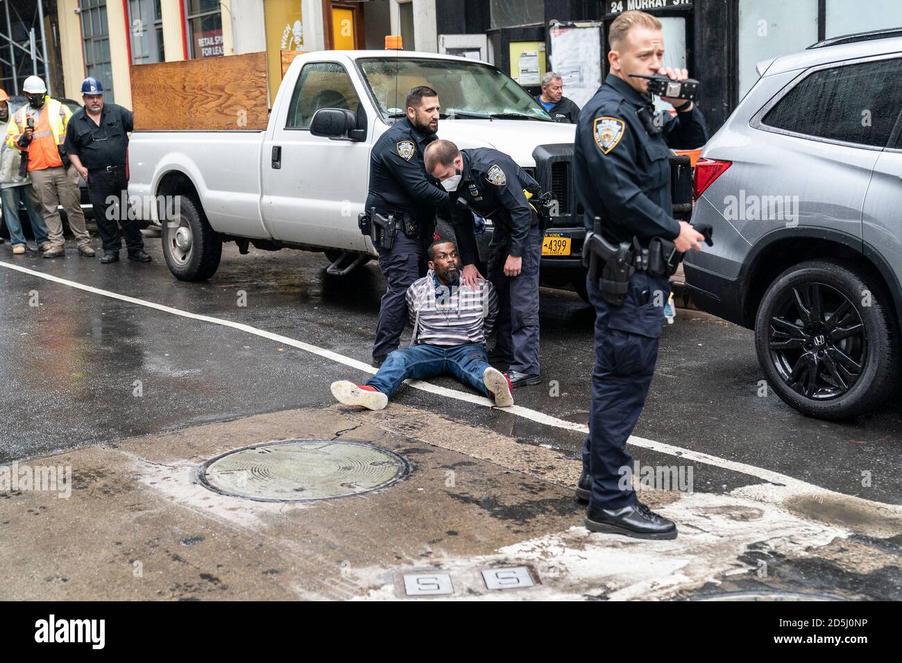 New York, United States. 13th Oct, 2020. Police arrested an emotionally distorbed homeless man and called EMS to get him help on Murray street in New York on October 13, 2020. Prior to his arrest, the man was fighting with other people and a bystander called 911. Police carefully placed the man under arrest and decided to call EMS for help. (Photo by Lev Radin/Sipa USA) Credit: Sipa USA/Alamy Live News Stock Photo