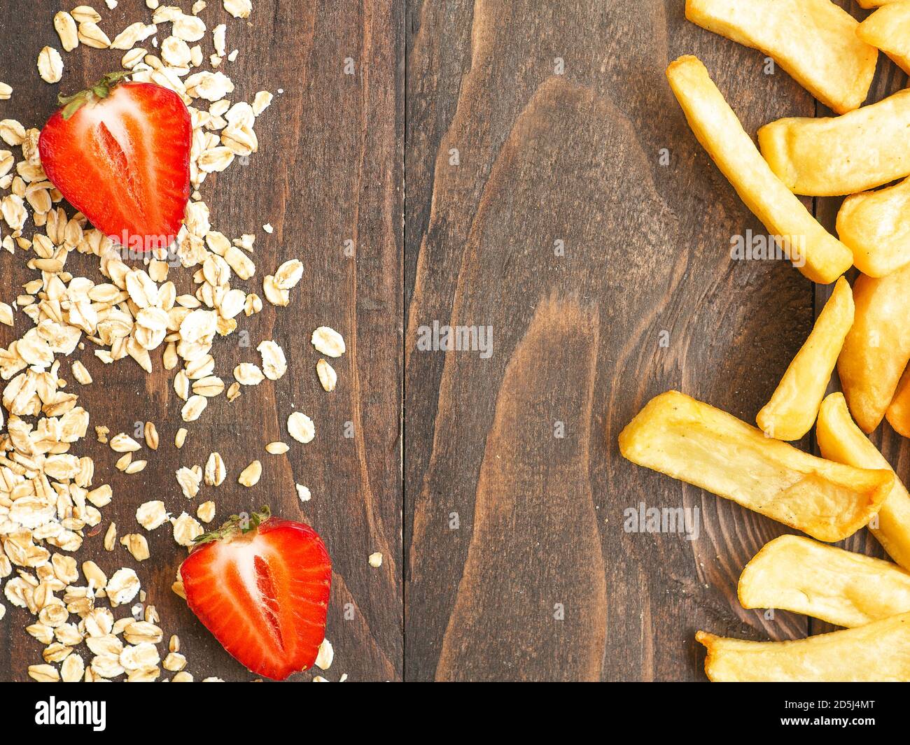 Healthy vs unhealthy food and dieting concept. Oat flakes and fresh