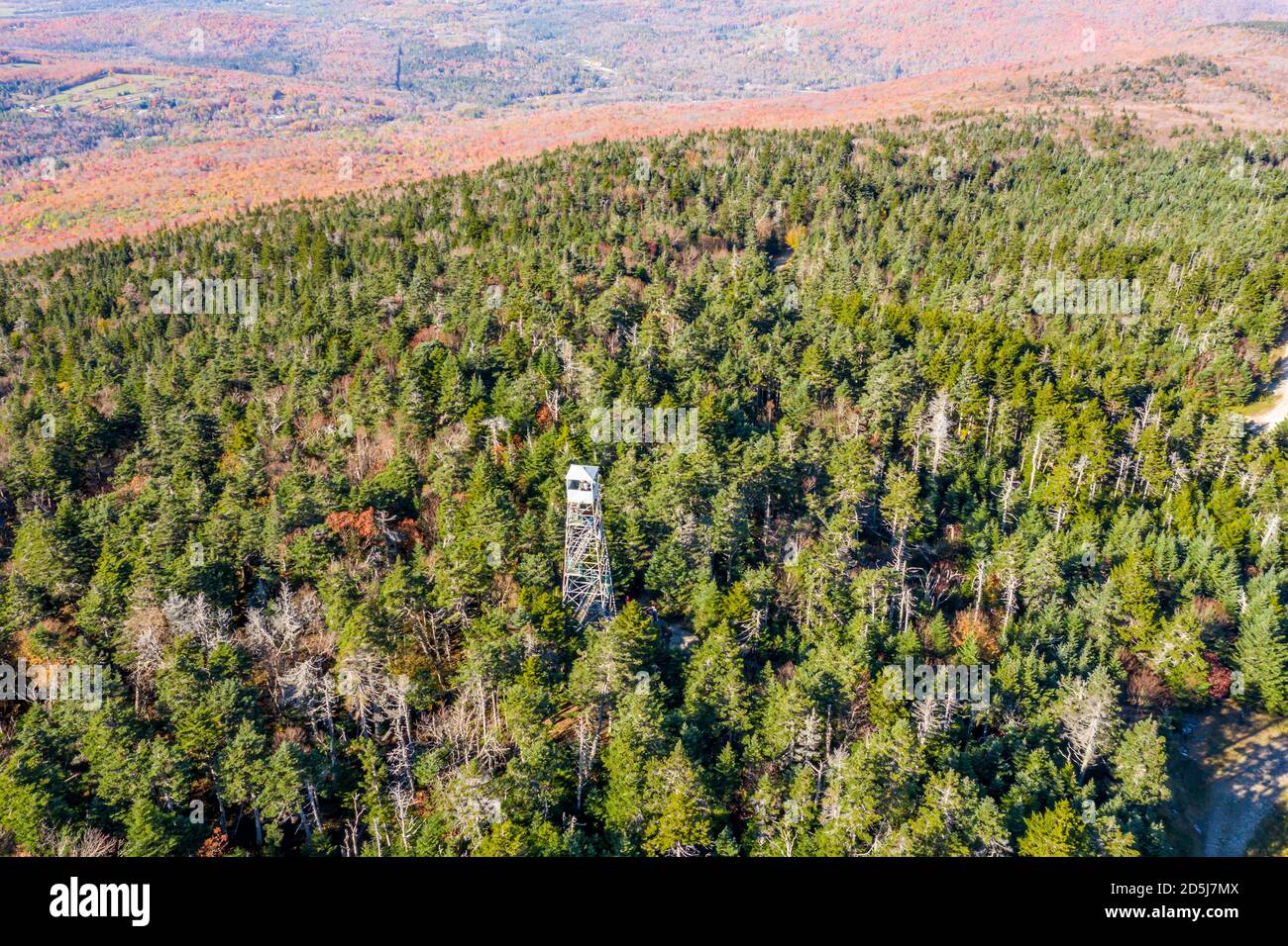 aerial of image of Okemo Mountain in the Fall and a lone fire tower