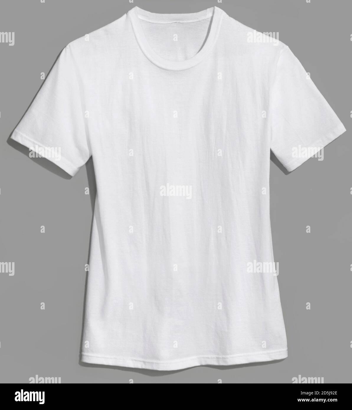 hanes plain white t-shirt photographed on a grey background Stock Photo