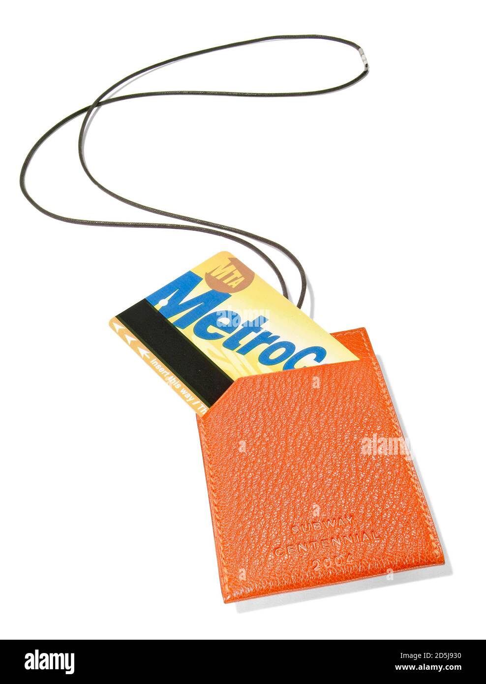 Orange leather metro card holder by Hermes photographed on a white