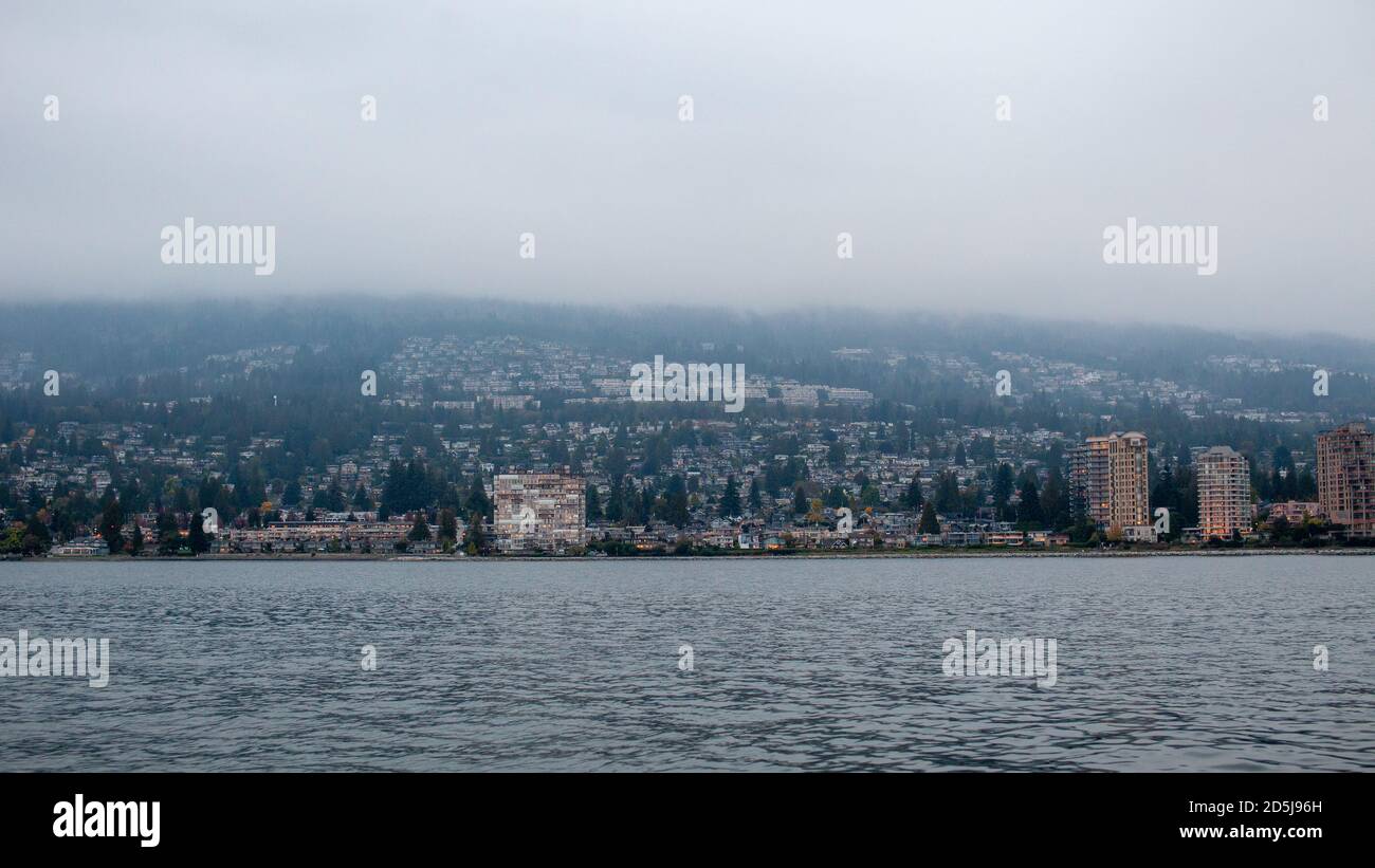 West Vancouver, British-Columbia / Canada - 10/04/2020: A view of West Vancouver from the ocean looking at the North Shore before the Lion's Gate Brid Stock Photo
