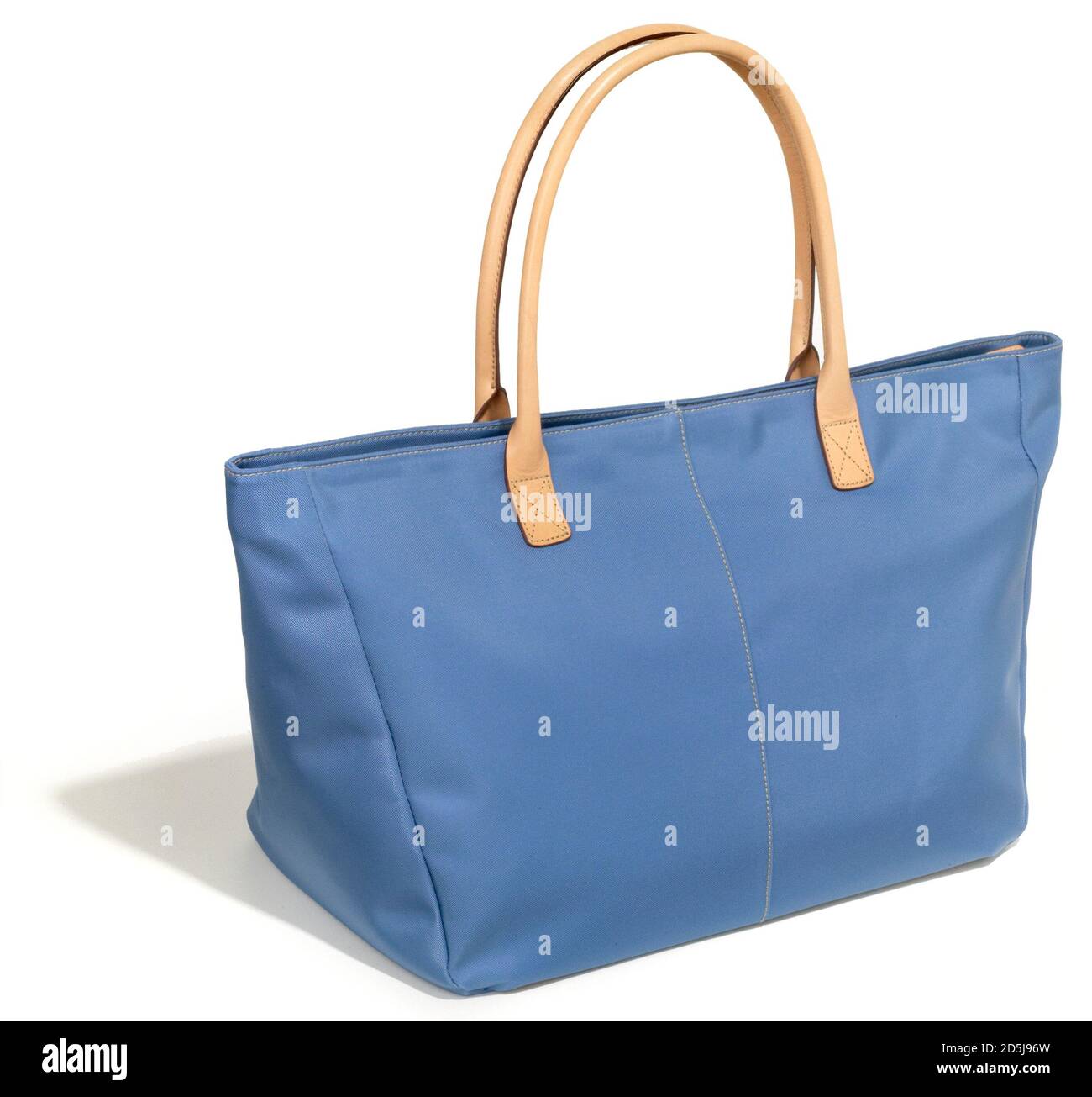 Land's End tote bag in blue with tan handles photographed on a white background Stock Photo Alamy