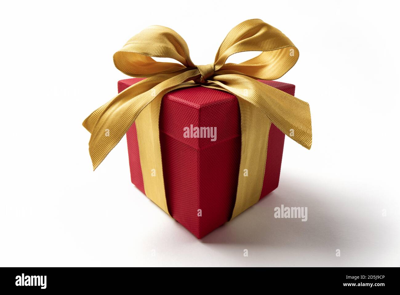 gift box with golden ribbon bow on white Stock Photo