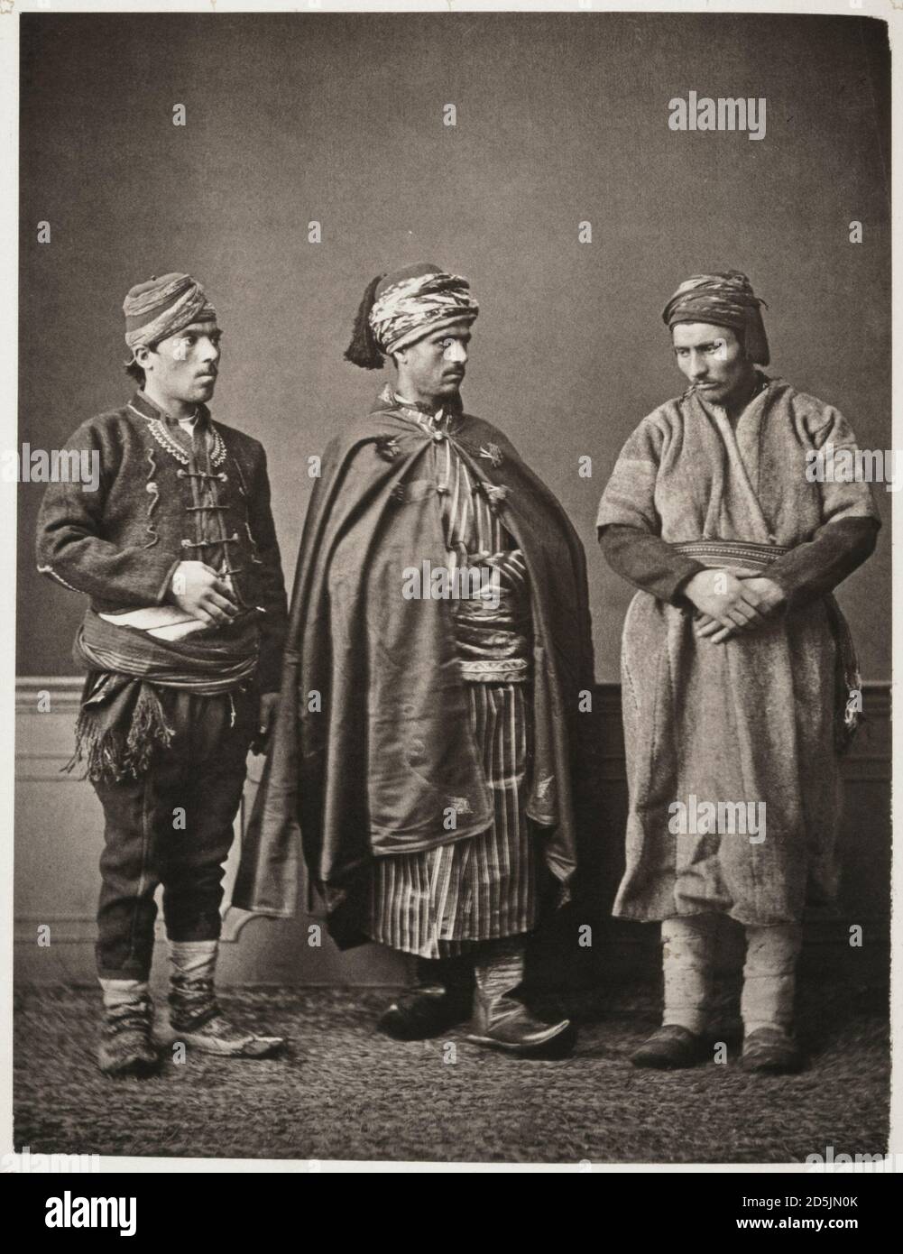 Studio portrait of models wearing traditional clothing from the province of Castambol (Kastamonu), Ottoman Empire. 1873  (1): peasant of Zafranbol (Sa Stock Photo