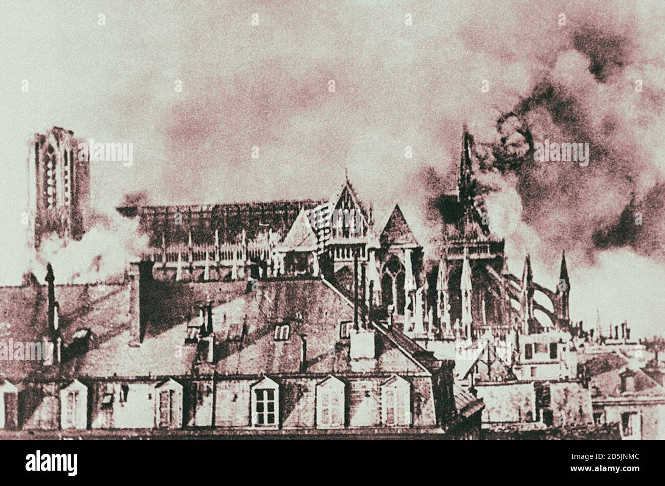 Bombardment of the Cathedral of Reims, France, in September of 1914, as German incendiary bombs fell on the towers and on the apse during the German i Stock Photo