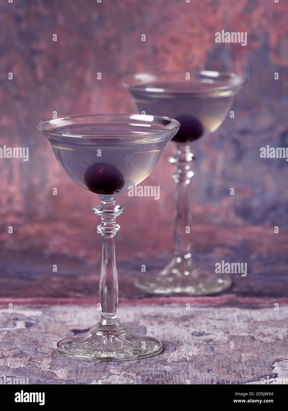 Aviation: a purple-bluish cocktail made with gin, maraschino, creme de violette and a dash of lemon juice, served with a maraschino cherry Stock Photo
