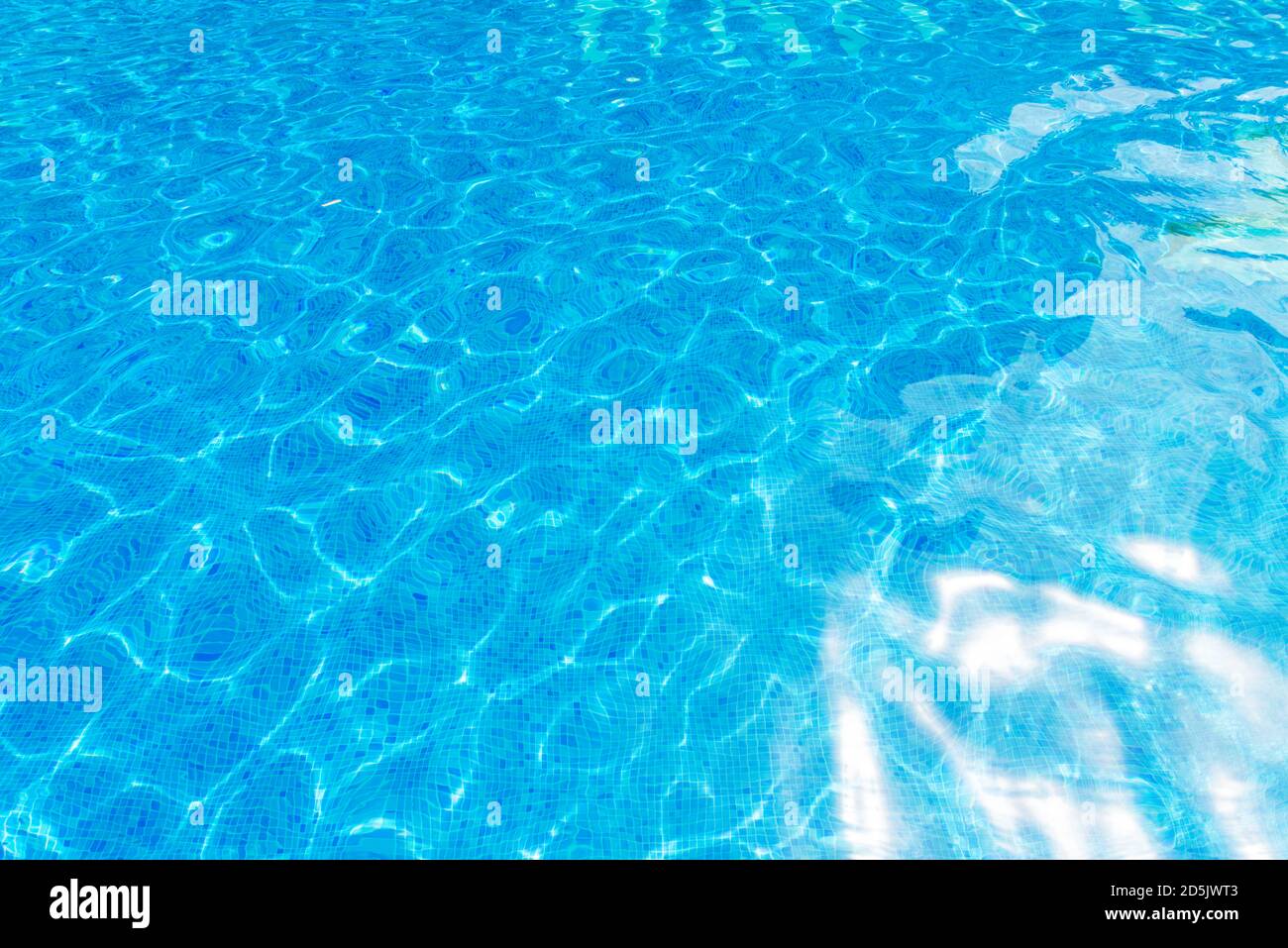 surface of blue swimming pool,background of water in swimming pool. Stock Photo
