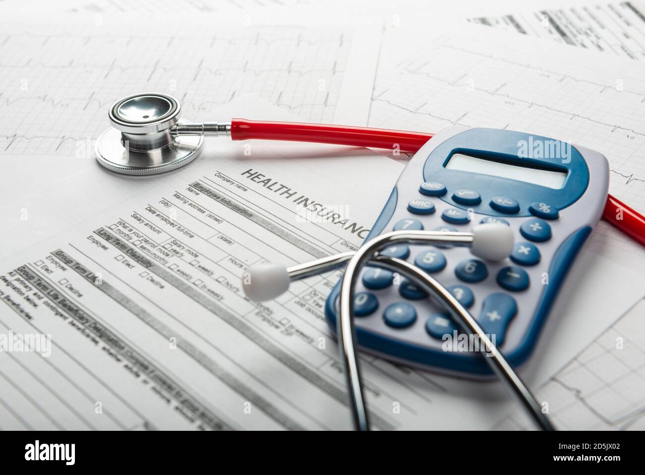 Stethoscope and calculator symbol for health care costs or medical insurance Stock Photo