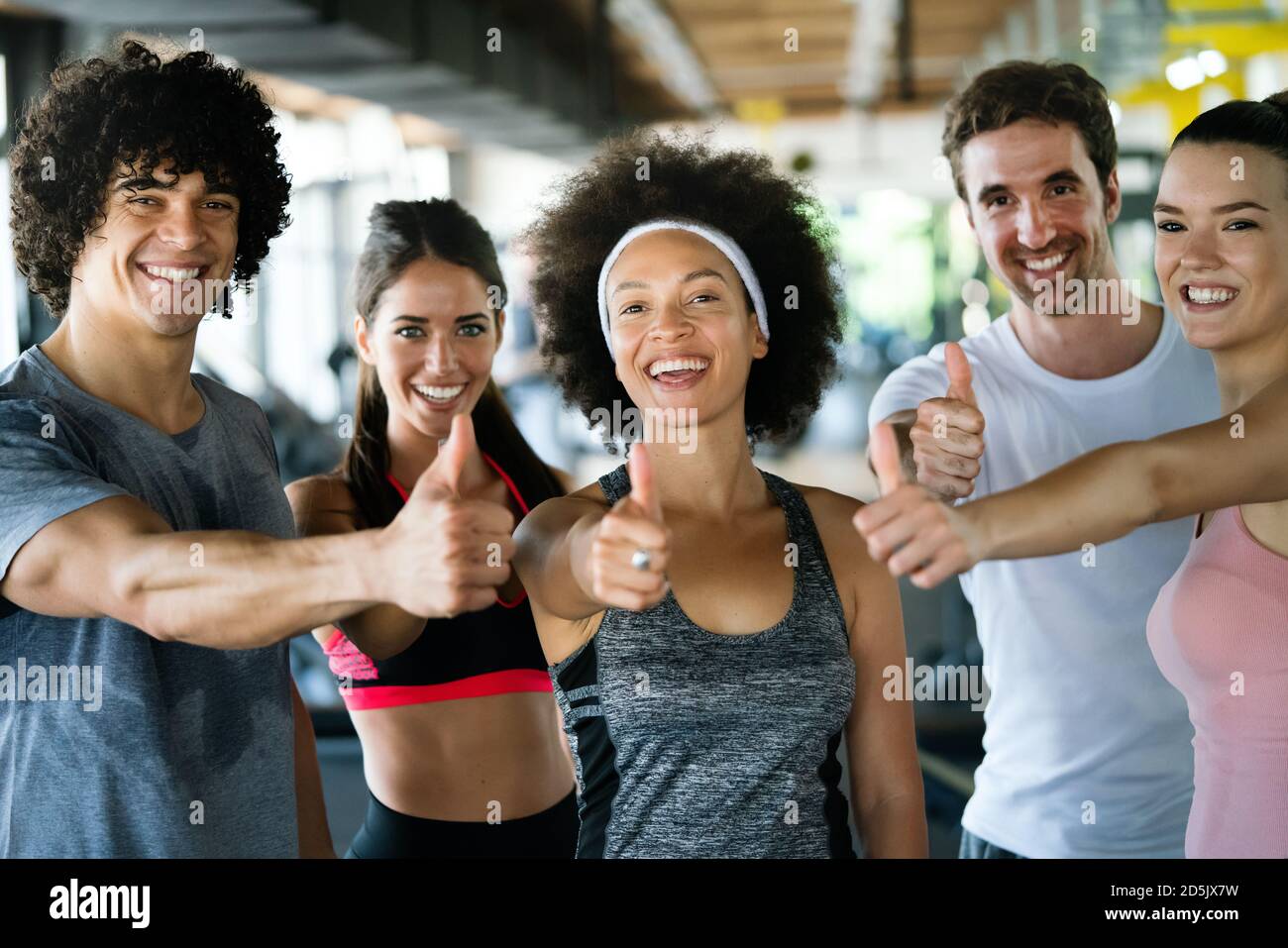 Picture of cheerful fit fitness team in gym Stock Photo - Alamy